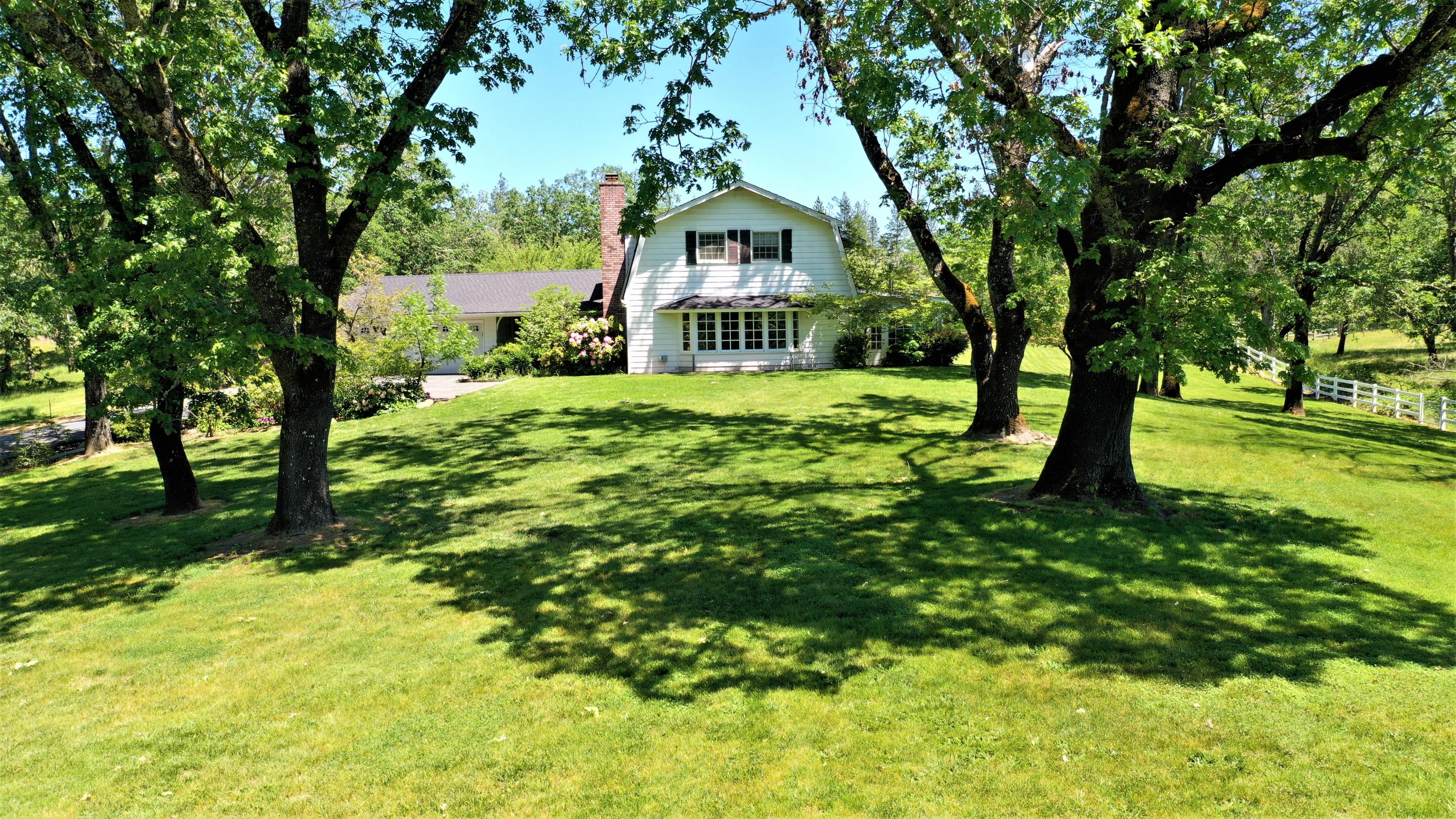 Amazing ranch near Finely Bend and the Rogue River, with privacy and abundant room to roam. The main ranch home is 3 bedroom, 2 1/2 bath, 2,240 sq/ft with a large open kitchen, formal dinning room & roomy living room; 2 bedroom, 1 bath 1,006 sq/ft guest house, large barn - with 4 stalls and tack room, separate detached shop with two full garage bays, bedroom/work room, full bathroom and a full above loft that is fully finished. All of this is tucked away on nearly 48 acres; of which is approx. 13 acres pasture land with irrigation, 20 acres of lightly treed grazing land - full of wild life; deer & turkeys galore, 2 wells(1 well is 40 gpm per well log), 2 year round ponds, fenced garden area with green house, two large open/ flat areas that could be additional garden area or space for riding arena. This could be a two family set up with room for a caretaker. Property is fully fenced and cross fenced with several separate pastures. Schedule a showing today, 2 hour notice, per caretaker.
