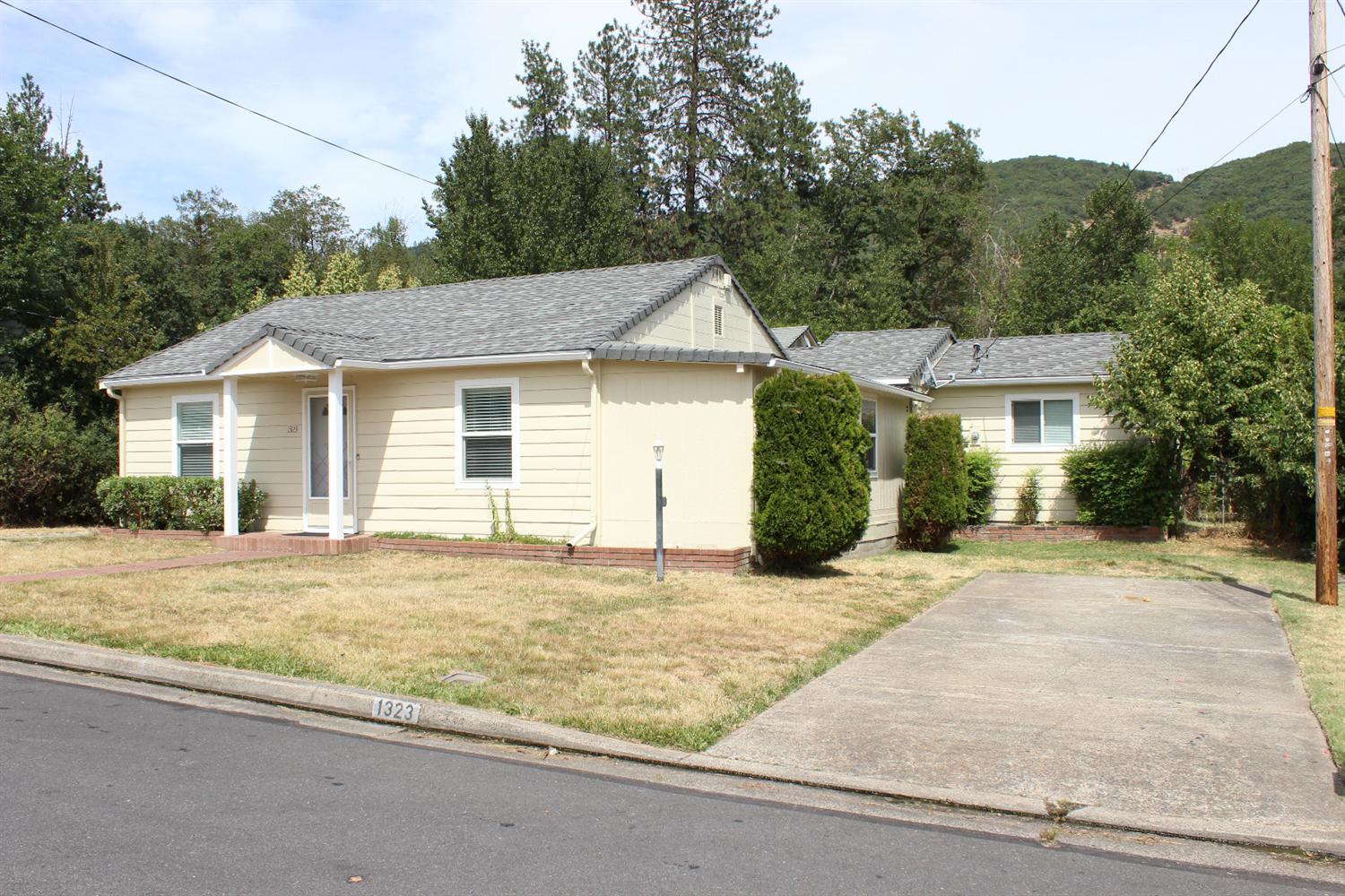 Nice three bedroom, three bath home with a lovely fenced yard in NE Grants Pass. The home features 1632 square feet, and has a large living room, great room, and bonus room. Located on a cul-de-sac. Home has central heat and air. Large oversized garage completes this package. Plenty of room for RV and boat parking. Large fenced in garden area and access to irrigation from GPID. Established fruit trees and a private backyard. Also, there is a 416 sq foot apartment above the garage that is currently rented. 1-bedroom apartment has its own yard, storage shed and laundry room. City has the apartment as an approved non-conforming use. Buyer to check with city for all approved uses and to complete proper due diligence. Buyer is not relying on any statements by Owner or Owner's Agent regarding uses of the apartment.