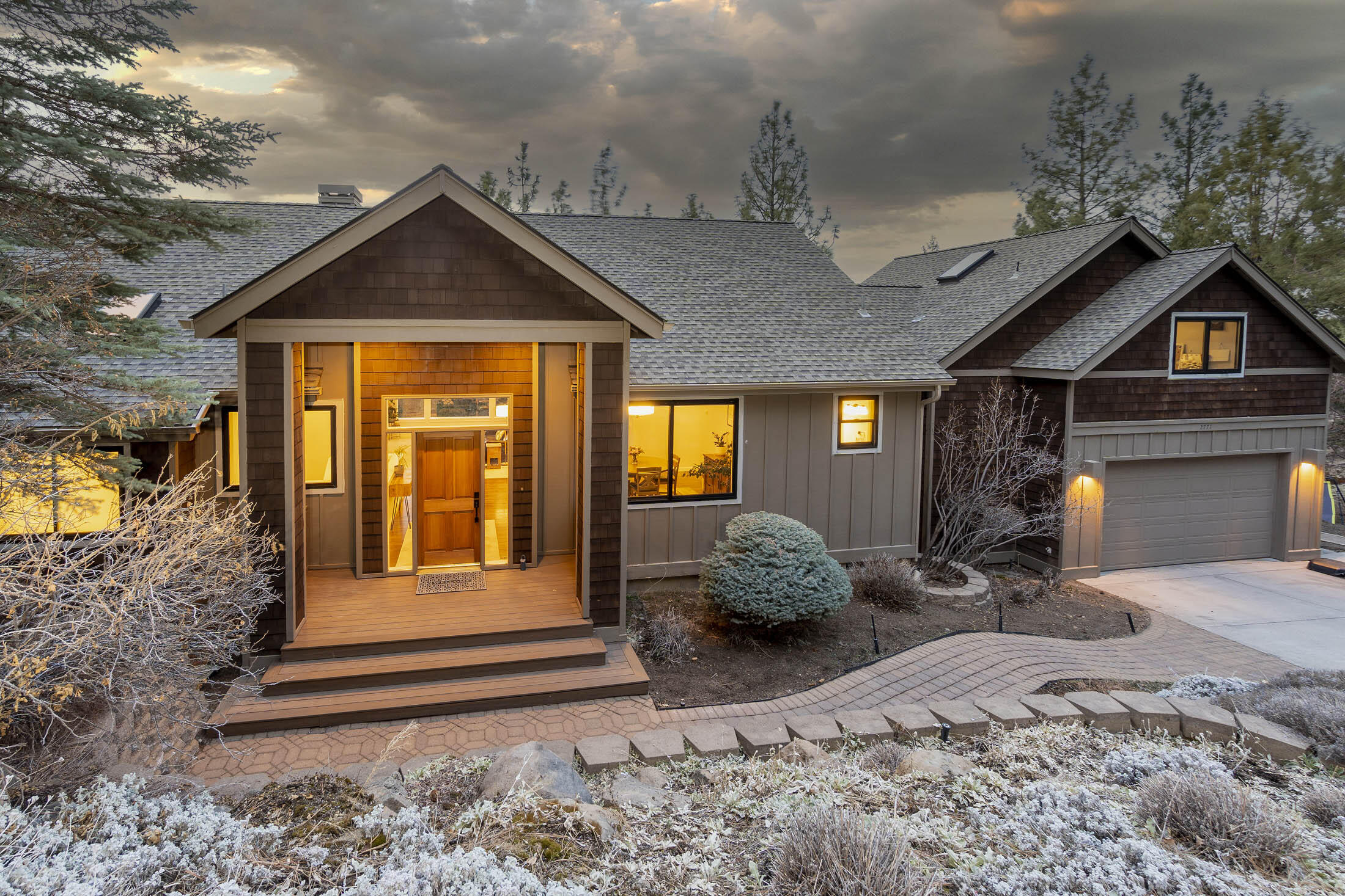 Welcome to your dream home with Cascade views situated on Awbrey Butte.  The main level features an open concept floor plan with high ceilings, ''HeatNGlow'' fireplace, built-in cabinets & walls of windows allowing plenty of natural light.  Spacious kitchen has center island, newer appliances, eating area, gleaming hardwood floors & sliding doors leading to the deck.  Primary bedroom is on main level which is large enough to have a sitting area, with walk-in closet, soaking tub, dual vanities, separate shower & views making this a hidden sanctuary away from guest bedrooms.  Downstairs you will find 3 guest bedrooms large enough to accommodate king-size beds.  The upper third level is a bonus room with space to convert to a 5th bedroom.  Enjoy outdoor entertaining on your deck for a BBQ, sunsets & wine.  New roof, heated driveway and much, much more!