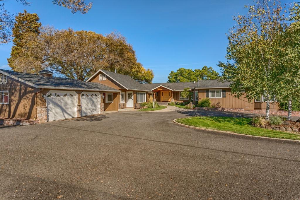 Horse Property w/5 irrigated acres 5 min to Downtown Jacksonville. French Countryside home & guest house over looking City Lights. Open beam ceilings, hardwood & travertine floors. 2 stone floor to ceiling stone fireplaces. Beautiful newer updates incl. a Lg chefs kitchen w/ every amenity (commercial dbl oven gas 6 burner cook top & griddle, warming drawer, beautiful cabinets, granite & wine refrige) Kitchen opens to dining & family rm, huge butlers pantry, great office/den off entry. Lg bedrooms. Master w/ dbl sinks, tile floors, walk in closet & private patio w/ hot tub. Many vaulted open beam ceilings. Very charming guest home w/ full kitchen, living rm, dining, full bath & 2 bdrms. 3 covered patios. In-ground pool w/ pool house & bath horse barn, riding arena, shop, extra covered parking. Basement / rec rm not incl. in sq ft.
