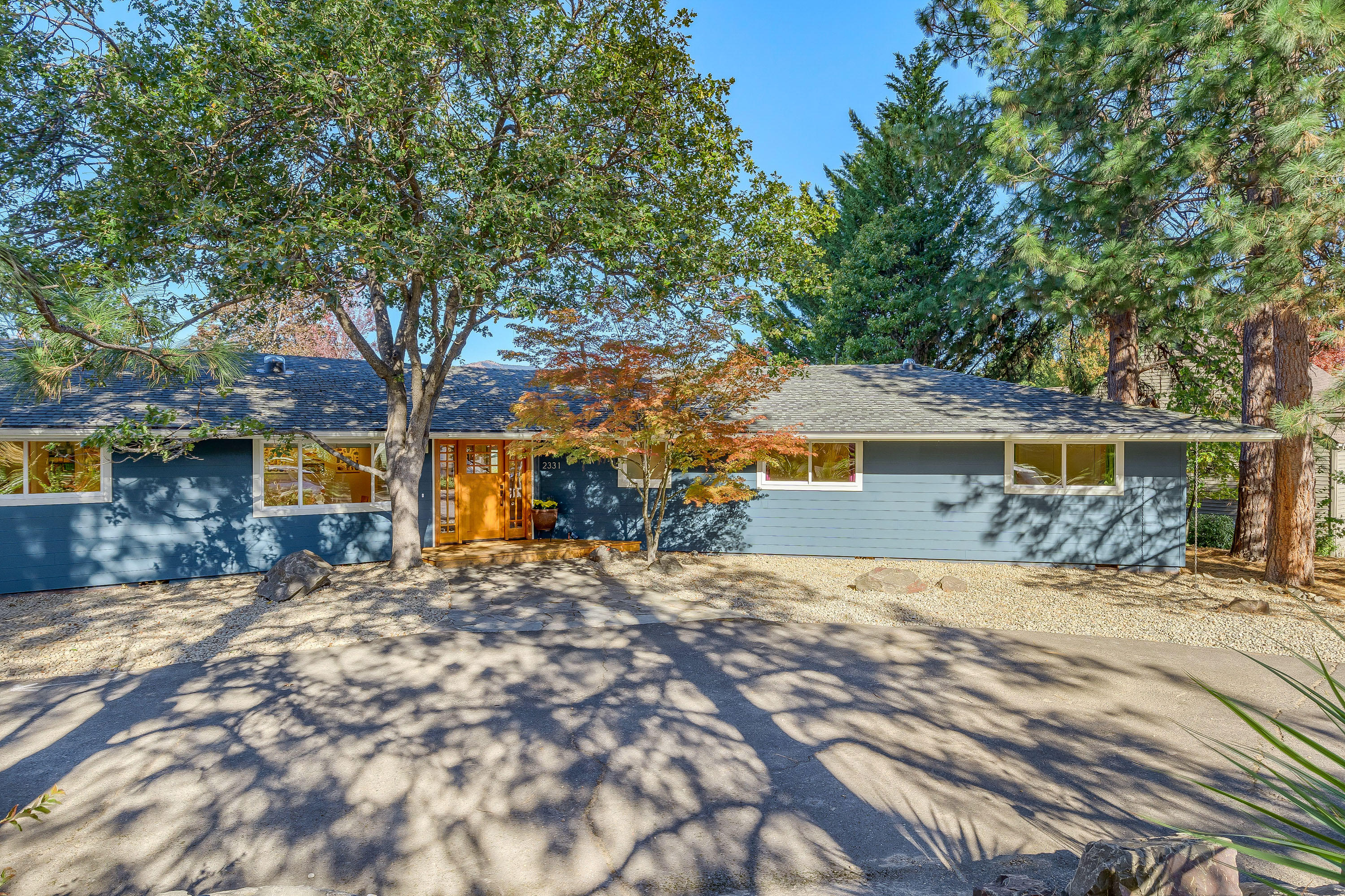 What a perfect place to call home. Plenty of space for all your indoor/outdoor needs. Potential 2-lot property on a large .65 acre corner (buyer to do their own due diligence). This single level home offers 4 beds & 2.5 baths. The floor plan is quite versatile, featuring two spacious living areas + a large office/rec room. Generous amounts of counter & cabinet storage in the light filled kitchen. There are dual pantries, an auxiliary bar area & eye catching island. You'll love the close proximity to hiking trails. Vaulted ceilings in the family room highlight the floor to ceiling wood-burning fireplace w/ stone surround. The master bath features a stylish vanity & easy access to the outdoor patio, hot tub & pool. The backyard patio is perfect for pool parties or a simple cup of coffee to enjoy the views of Cascades. Plenty of storage outside w/ three large storage sheds and an enclosed workshop. Plentiful vegetable garden, chicken coop and the list goes on.