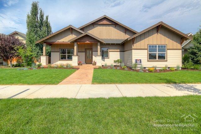 Beautiful custom single level home that will be featured in the 2014 COBA 2014 tour of homes! 4bed/2.5bath with a fantastic floor plan featuring oak distressed wood floors, textured euro-style cabinets, kitchen island, open shelves & 2 benches made out of 1920's reclaimed lumber. Unique light fixtures, handicap accessible interior with wider doors, halls & wheel in tile shower. Brushed quartz counters in kitchen, polished quartz in bathrooms. Landscaped w/sprinklers. Large pantry. Tons of storage.Very nice.