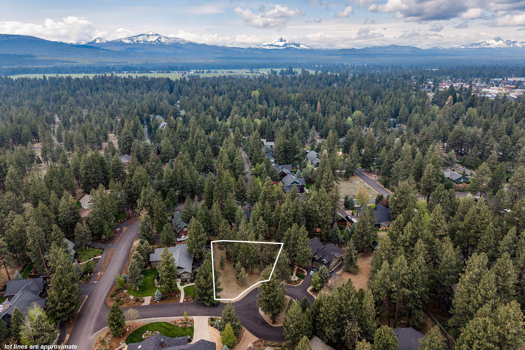Come build your dream home in Coyote Springs where you will discover the best of in-town living with a natural, wooded setting! This prime cul-de-sac lot is the perfect opportunity to create the ultimate basecamp your Central Oregon life.  Literally at your doorstep are the Sisters Athletic Club, Creekside Park, & vibrant eateries and shops that perfectly capture the Western spirit of the town. Proposed house plans by acclaimed Jason Todd call for a single-level Farmhouse-style design intentionally designed to maximize privacy & south-facing light. The plans also incorporate a 1036sf garage for all your gear/toys plus two ensuites, 10-foot ceilings, dining room with French doors, & a spacious gourmet kitchen overlooking the living room. Accompanying landscape plans make this package ready to submit for city's planning approval with your preferred builder and streamline the building process. This is truly a remarkable opportunity to turn your Central Oregon dreams into reality!