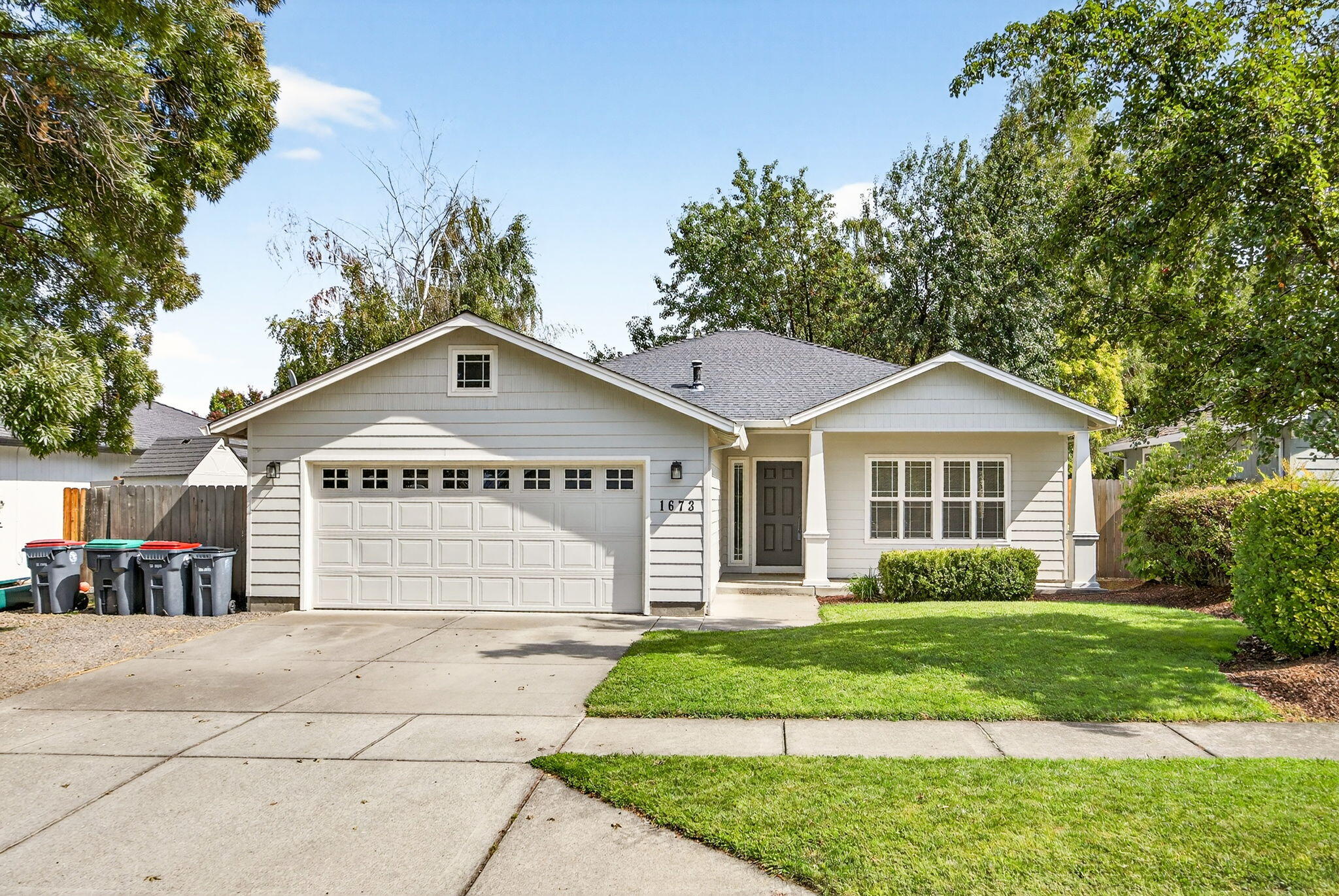 Located just blocks from South Medford High you will love this this single level 3-bedroom, 2-bath home featuring a wonderful floorplan for functional living. The kitchen features granite countertops, a center island, stainless steel appliances, and a cozy eating area. Enjoy the warmth and durability of easy-care luxury vinyl flooring throughout the main living areas. The home beams with natural light enhanced with skylights creating a bright and airy atmosphere. The spacious primary bedroom is a nice retreat with an full ensuite featuring a granite-topped vanity. Step outside and relax on the covered patio, perfect for year-round enjoyment, overlooking the fully fenced and landscaped yard—ideal for pets, gardening, or relaxing in privacy. This home also features an attached 2 garage plus a dedicated indoor utility room. This home is ready to welcome its new owners!