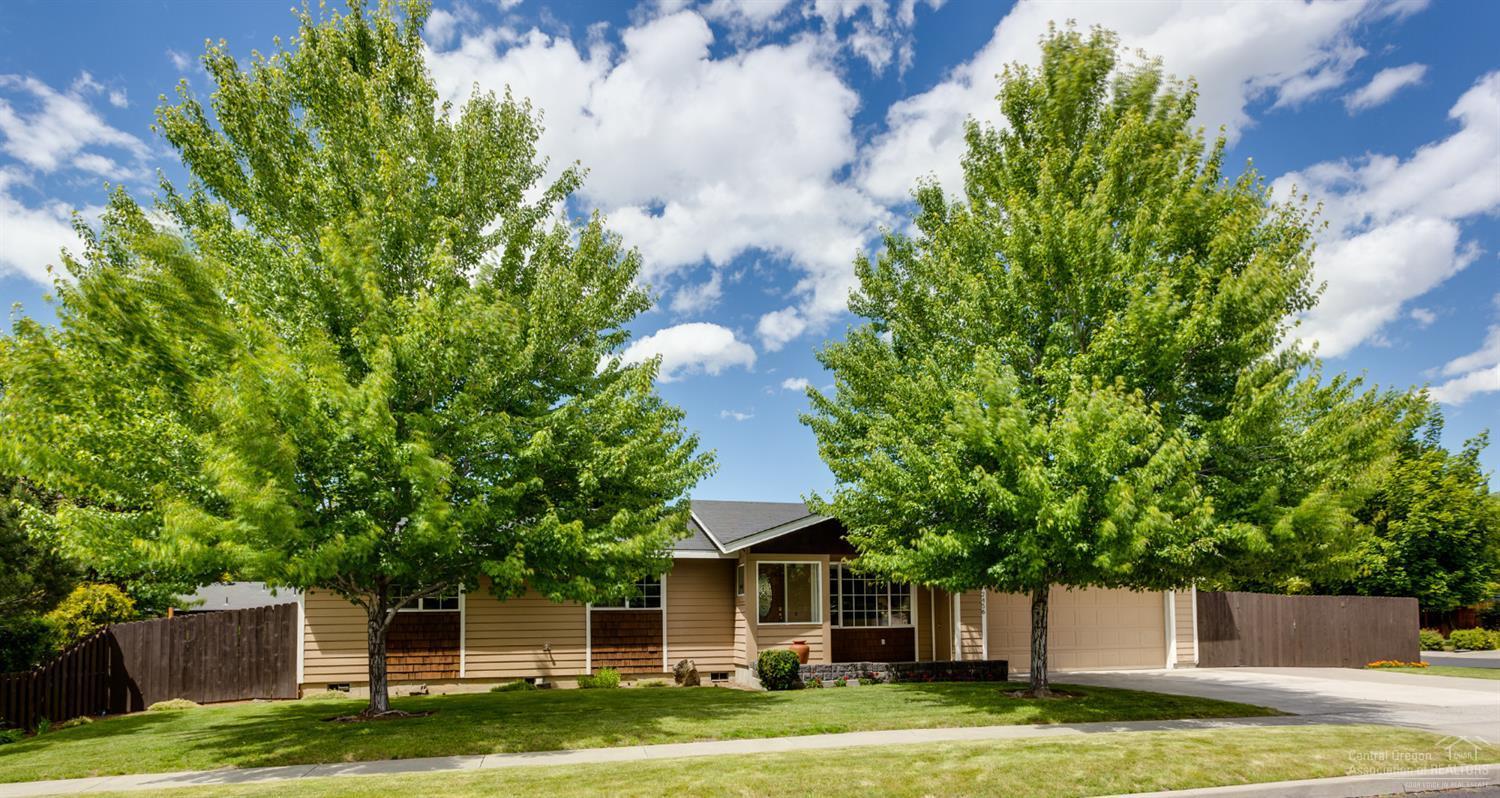 Move in ready, single level home with open floor pland & fenced RV/toy parking. Beautifully cared for home updated with knotty alder wood floors, granite tile counters in kitchen, custom alder cabinets with pull outs, gas range. Living room features vaulted ceilings & gas fireplace with alder mantle & surround. Bathrooms updated with tile floors and vanities. County records show 3 bedrooms but 3rd is currently a den without a closet. Lots of natural light including solar tube. Large fenced, landscaped & sprinklered corner lot with spacious covered back tiled patio and sheltered front entrance. 8x18' storage building,plus finished 2 car garage (26'10 deep) with built in storage/workbench. Perfect for downsizing, second home, or first time home buyer! Don't miss this one!