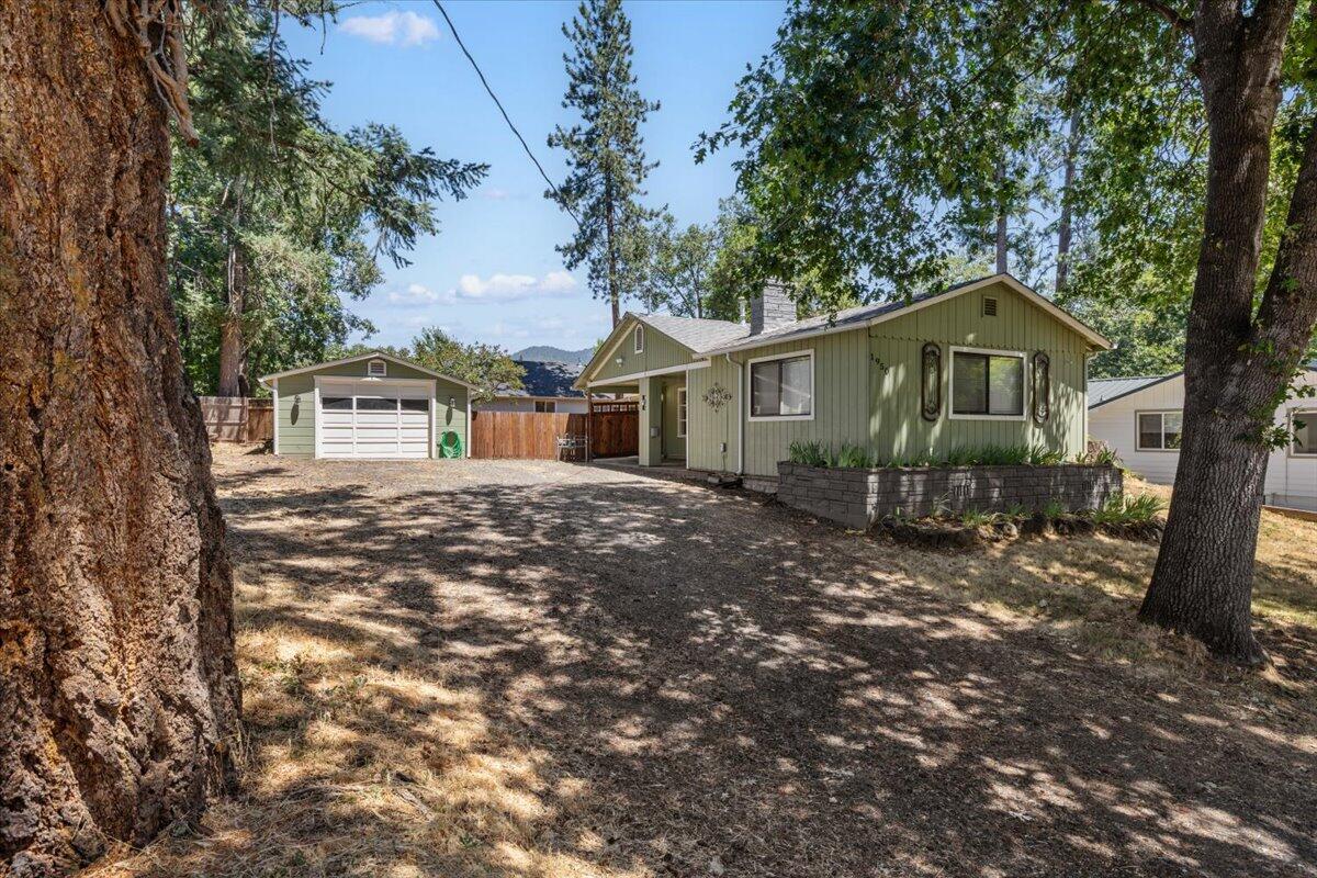 Great home for a first-time buyer or downsizing. The property features a large .32 acre lot with mature trees, a big and private backyard and plenty of parking. Located in a quiet neighborhood close to George Eckstein park and the Rogue River. Includes detached garage, space for an RV and an extra 10X10 storage room. Move-in ready. Don't miss this one!