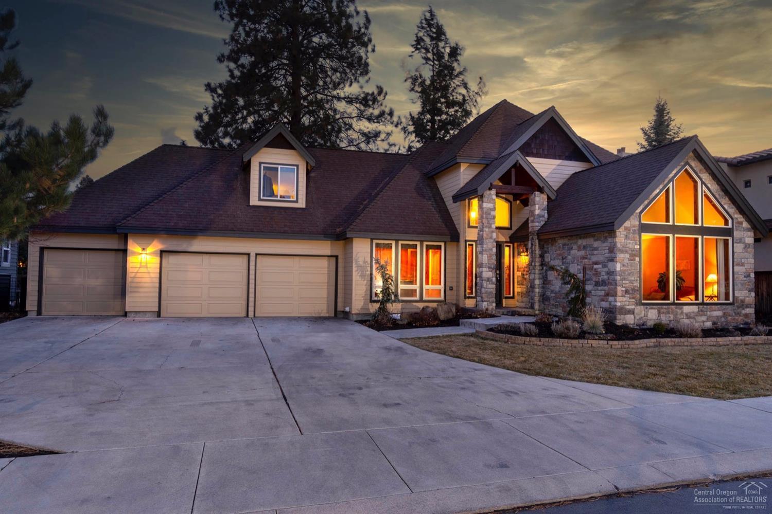 Gorgeous custom built 3 bed/2.5 bath home, 2757 sq.ft. on spacious .20 acre lot, backing canal for your peaceful enjoyment. Stone accents, new ext. paint & updated landscaping add to the curb appeal on this stunning home. Main level hardwood flrs, vaulted living rm, den/office w/elegant Brazilian cherrywood finishes, formal dining & kitchen/breakfast nook areas w/SS appliances & granite counters. Family room boasts gas fireplace w/hearth to keep it cozy. Solid hickory trim & knotty alder doors & cabinets. New int. paint throughout. Large picture windows keep it light & bright. Double door entry to master w/walk-in closet, private bath w/radiant heat tile flrs, dbl. vanity, soaking tub & tile shower. Large bonus rm/4th bedroom. Fenced back yard w/deck & paver patio & fragrant magnolia trees to enjoy all summer long. Auto sprinkler/drip systems. 3 car gar. w/remotes & ample parking in driveway. Ideal location w/small park across street, & convenient to future new high school & park.