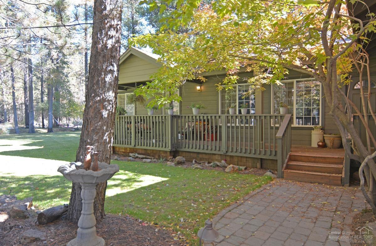 Looking for a well maintained 3 bed 2 bath home on over half acre? This could be it. This home sits on a corner lot with mature trees and landscaping, fenced, paved driveway with RV parking. Enter the home through the covered front porch with wood floor entry that runs throughout the kitchen, and a vaulted open living area. Newer carpet, paint, appliances and other updates. Extended living on the covered back deck with hot tub. Attached double car garage.