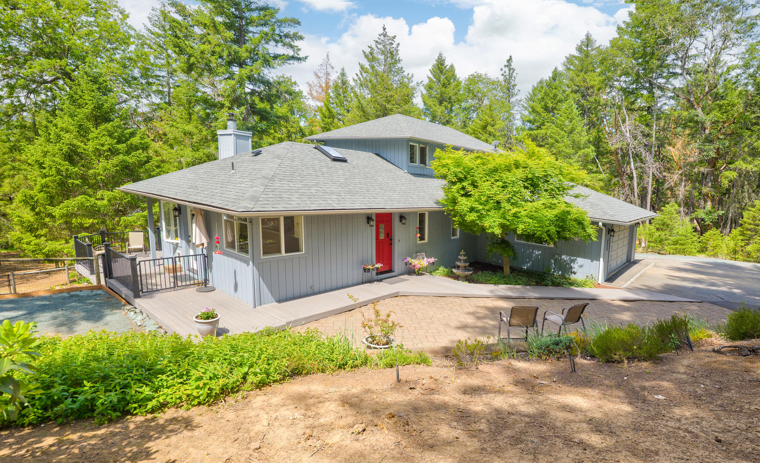 Welcome to your peaceful 4-acre retreat in Shadow Hills Estates! Surrounded by trees and next to an 80-acre forest, this home offers privacy and serenity. Step inside to a light and bright kitchen with new stainless appliances (2024), perfect for cooking while enjoying nature views. The cozy sunken living room with a woodstove creates a warm, inviting space to relax. The spacious primary upstairs bedroom offers a peaceful retreat with views of the trees with 2 additional bedrooms on the main floor. Updates include a new heat pump (2024), water filtration, and water heater (2023). Enjoy a 1,225 sq ft finished shop with 10-ft walls, 100-amp power, mini-split HVAC, and RV parking.