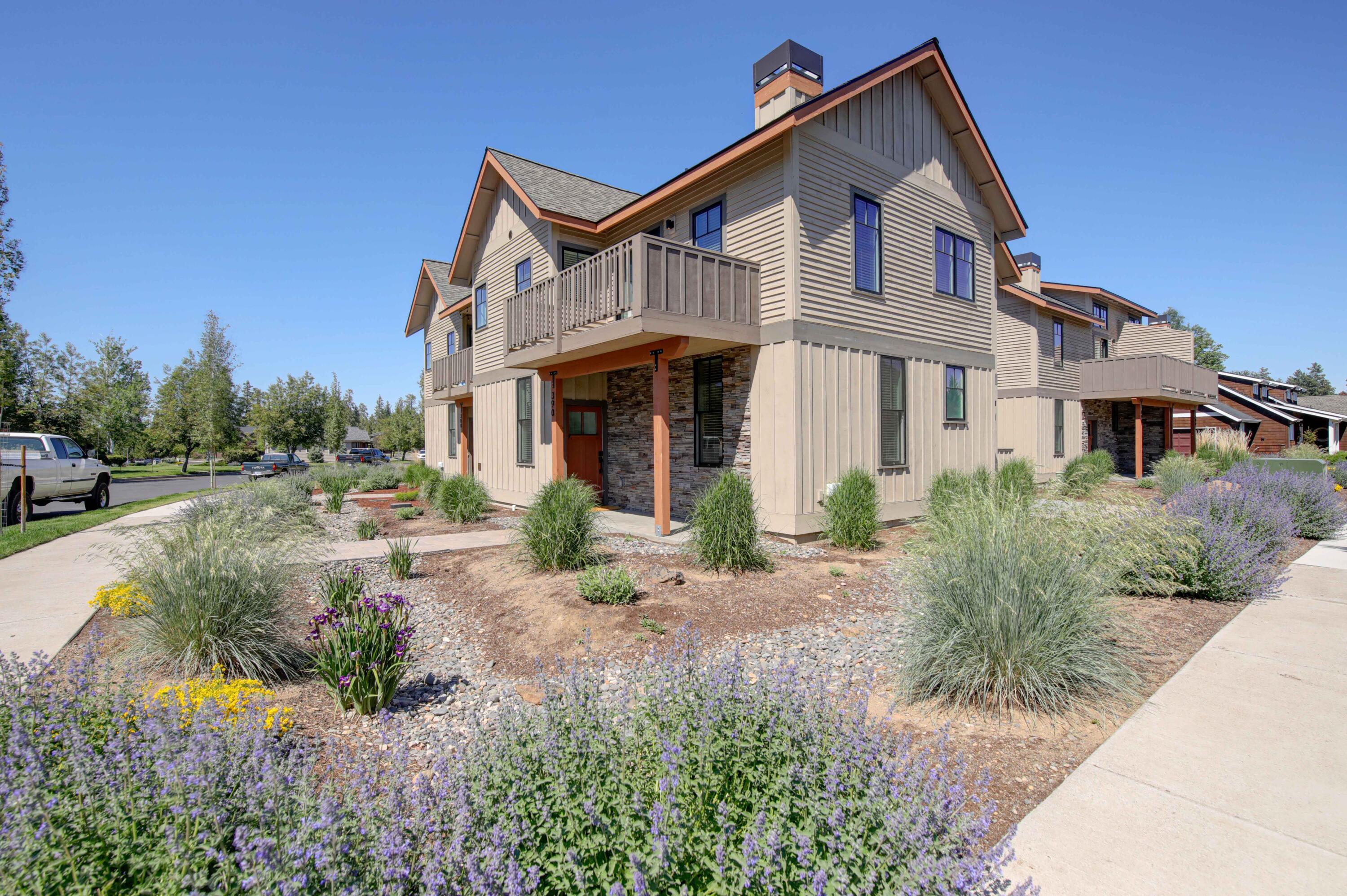 Contemporary Townhome in the desirable Pine Meadow Village neighborhood. Corner unit means lots of windows and natural light on both sides. Interior features include: Upper level living; view of mountains from the great room; black stainless steel upper-end appliances; vaulted ceilings; well designed open concept living; abundance of storage; large kitchen pantry; 2 primary ensuite rooms, both up and down, for privacy. Exterior features include: Mountain views; upper deck; low maintenance landscape. All the amenities of Pine Meadow Village including tennis courts, pool, waterway, and open space.