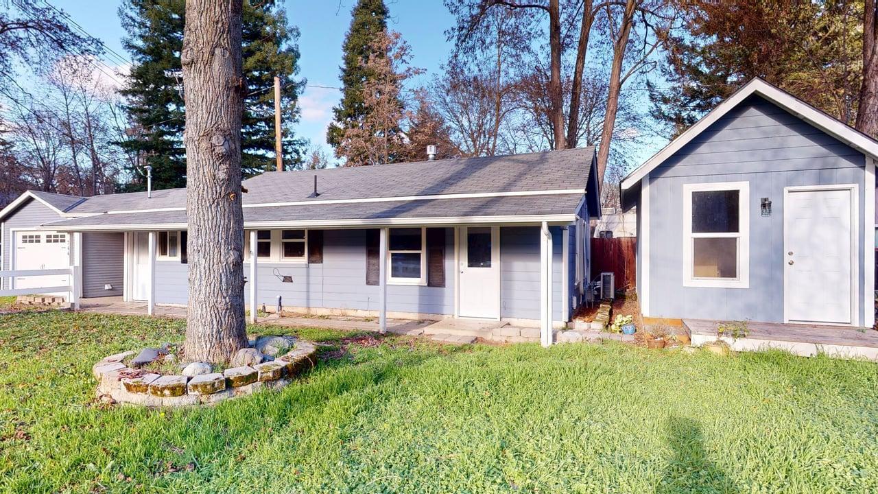 Turn-key cottage located in an area of historic homes in Grants Pass. Approximately 688 sq ft, this 2 bedroom, 1 bath home offers a functional layout with a generous laundry/mud room. All appliances are included: washer, dryer, stainless steel refrigerator, range/oven, dishwasher, and stainless microwave. Three ductless mini-split systems provide efficient heating and cooling, along with a gas fireplace for added comfort.

Recent tasteful updates include painted cabinetry, tile backsplash, tile shower, and upgraded countertops. Exterior features include a garage with breezeway, covered front porch, and a newer detached shed with power. A well-maintained property offering charm, efficiency, and move-in-ready condition in a desirable Grants Pass location.  All information is deemed reliable but not verified, buyer to do their own due diligence.
