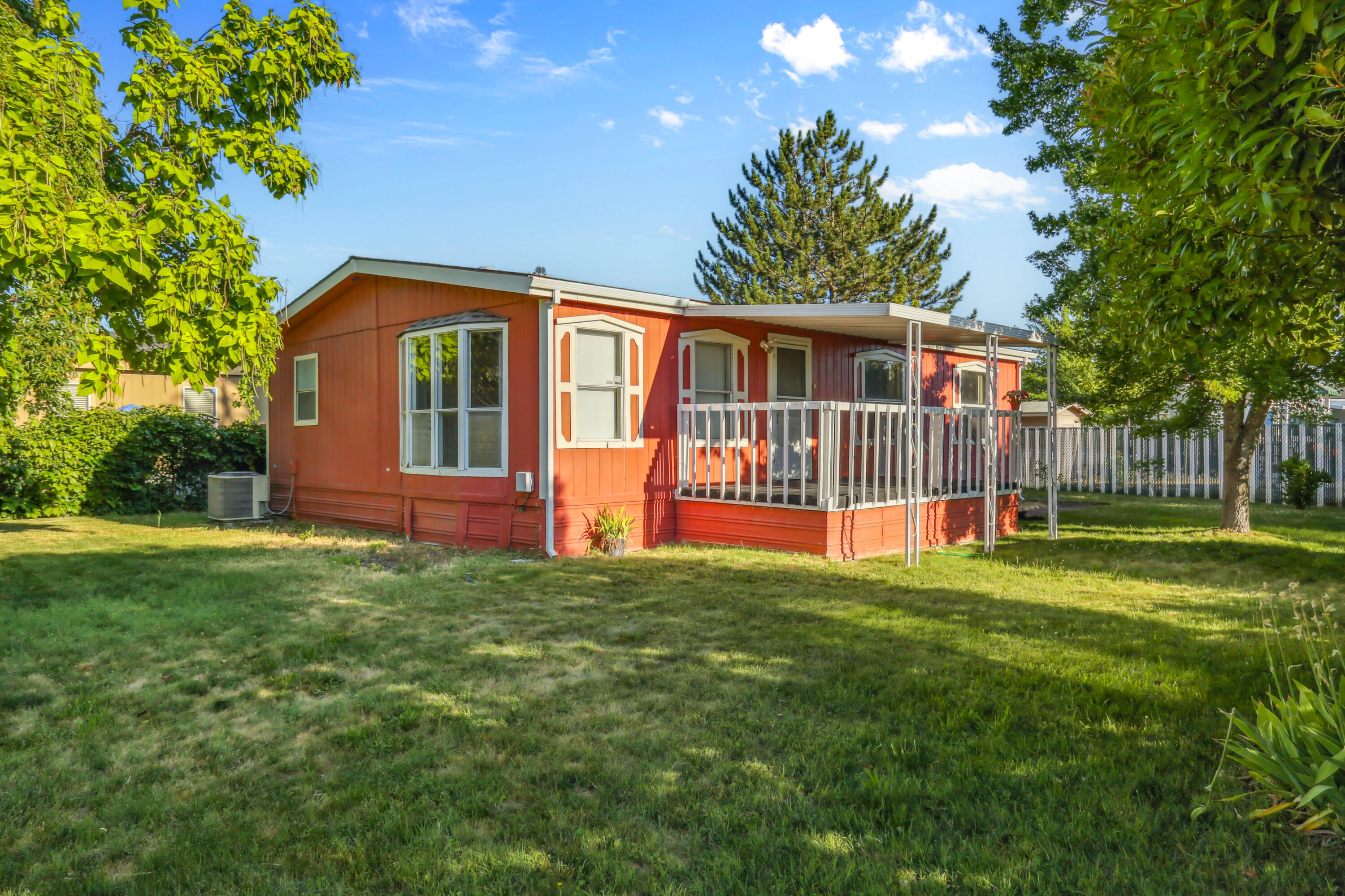 Enjoy stunning views of Mt. McLoughlin from this inviting home at 6850 Downing Rd #65A in Central Point. Ideally located next to a playground and open pastures, this property offers a peaceful, scenic setting with room to breathe. The fenced lot is one of the biggest in the park. The home features a light-filled living area, functional kitchen, and cozy layout perfect for everyday living. Relax on the front porch while taking in the mountain views, or enjoy the quiet comfort of this well-maintained community. Conveniently close to shopping, schools, and I-5 access. A rare opportunity for affordable living in a beautiful location!