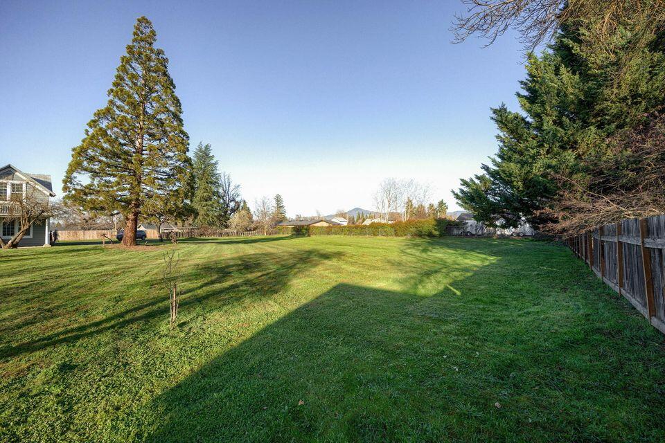 RARE 1-ACRE MEDFORD INFILL PARCEL! Developers and investors, this is the versatile opportunity you've been waiting for. Situated in a prime Medford location, this level, 1-acre property offers a blank canvas for your next high-demand project. The key is the flexible SFR-10 zoning. This designation is a developer's dream, moving beyond standard single-family restrictions. It explicitly allows for single-family homes, duplexes, AND 4-plex units, giving you multiple paths to profitability. Build a boutique community of custom homes, a portfolio of income-generating duplexes, or maximize your density and returns by developing 4-plexes to meet the Rogue Valley's critical need for ''missing middle'' housing. This sought-after location provides easy access to schools, shopping, and major medical centers. With utilities nearby, this parcel is prepped and ready for your vision. Don't miss this chance to build significant equity in one of Oregon's strongest markets. Bring your plans!
