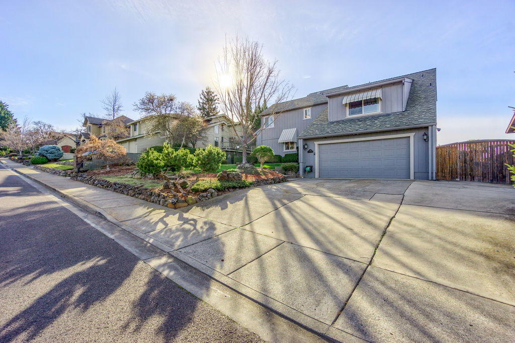 Beautiful updated Manor Hill home w/Views of the City lights, Valley & Mountains. Lg vaulted wood ceilings in Great rm w/brick wood burning fireplace, dining rm w/ slider to a beautiful backyard all fenced, lg cement patio for entertaining. 2nd paver patio for relaxing. 3rd patio off kitchen w/French doors. A great courtyard breakfast patio. Nice stainless appliances w/gas cook top, wall oven, Corian style counters & white cabinets. 80% of the home has new beautiful water proof flooring. Master on main floor w/ slider to patio. Marble counter in bath, lg tile shower. 3 bdrms upstairs w/ updated bathrooms, dbl sinks w/ Carrera marble counters & great storage closet. Great office/hobby rm off 4th bdrm. Open railing into great rm/dining rm from upstairs hallway. Beautiful inside & out!