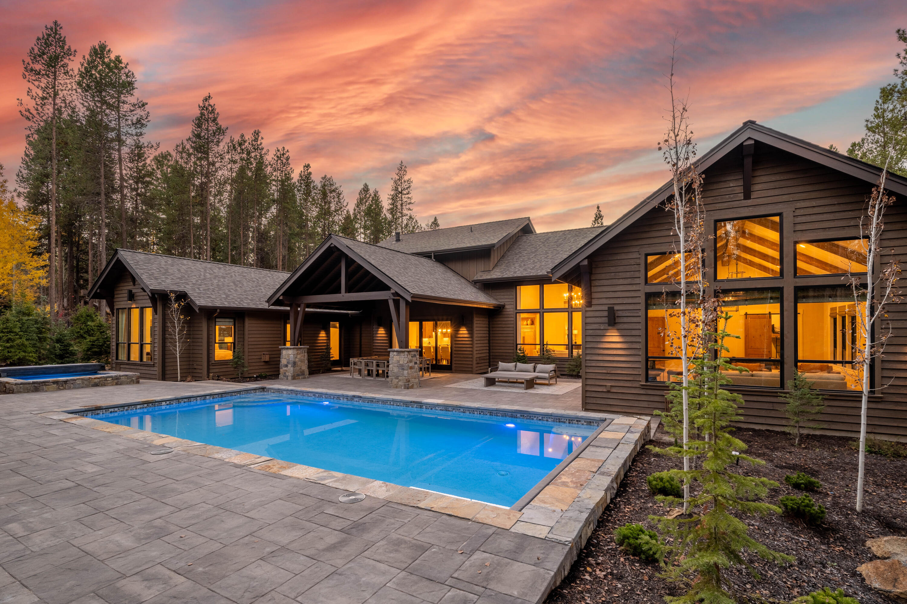Experience the pinnacle of luxury living in this exquisite Caldera Springs residence. This home seamlessly blends modern sophistication with the tranquility of its natural surroundings, offering a lifestyle like no other. As you step inside, be enchanted by the graceful flow of open living spaces, bathed in an abundance of natural light. The heart of this home is a gourmet kitchen that leaves nothing to be desired. Entertain in style in the interconnected great and game rooms, where multiple fireplaces beckon relaxation. Slide open the large doors to reveal a backyard oasis, featuring a private pool, a pool house complete with a full bath and steam sauna, an in-ground spa, and over 2,000 square feet of outdoor living space. An entertainer's dream, perfect for enchanting alfresco dining or hosting soirées beneath the stars. Sold fully furnished, this is not just a house; it's your dream home waiting to become a reality.