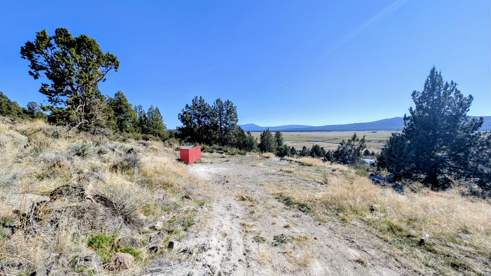 THIS PROPERTY HAS A WELL AND WELL HOUSE. 1.55 ACRES. NICE VIEWS! BUILDABLE LOT. OVERLOOKS THE SPAGUE RIVER AND VALLEY. HAS A DRIVEWAY THAT IS DIRT. SOME LEVELING. DEBRIS WILL BE REMOVED OR BURNED AS MUCH AS POSSIBLE. CURRENTLY NO POWER, SELLER HAS USED A GENERATOR TO POWER THE WELL.