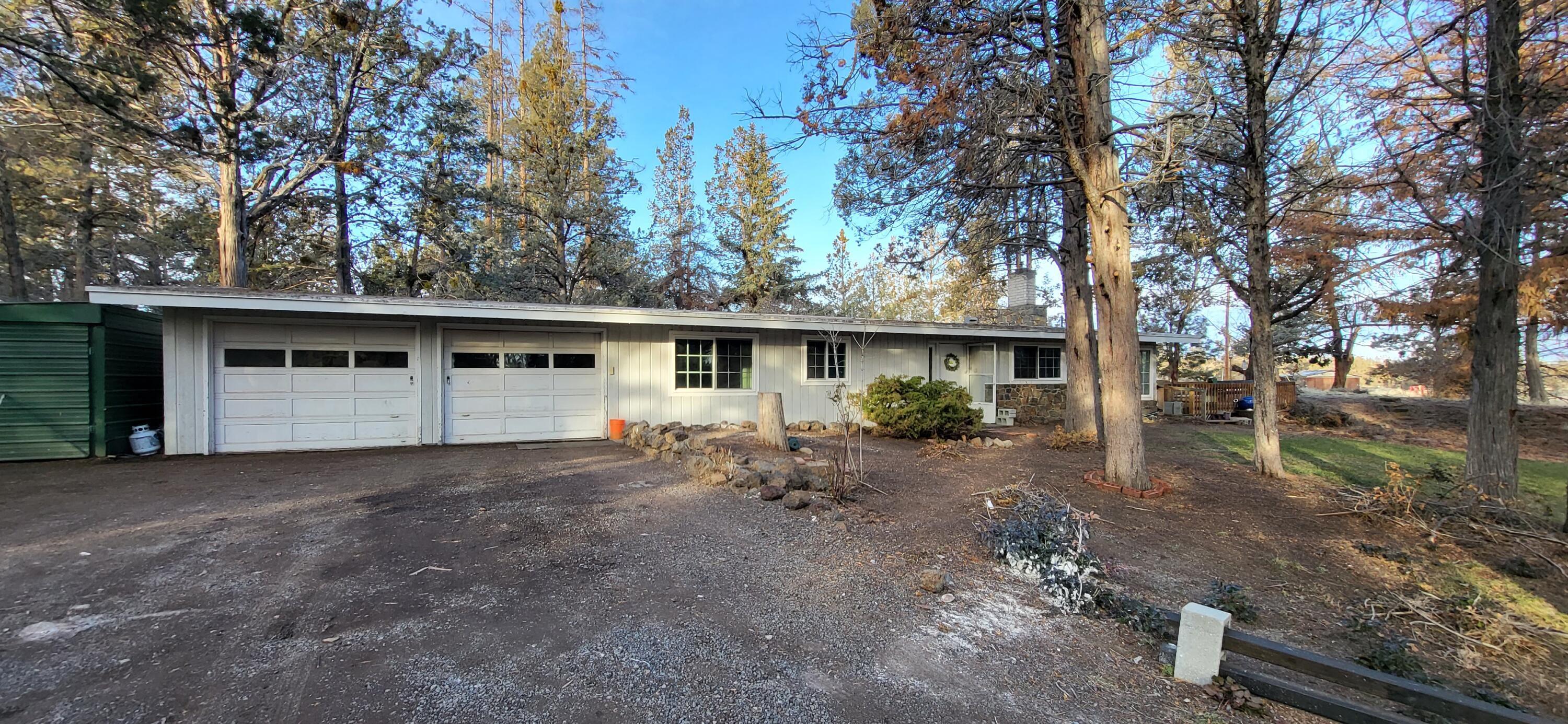 Single Level 2 bed 2 bath ranch home on large beautiful 6.13 acre parcel with one (1) acre irrigation.  This home sits well back from the road and borders Bowery rd.  Great opportunity to be close to town, amenities, and still have peace and quiet.