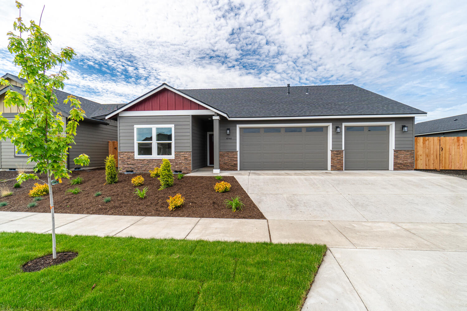 Affordable luxury built by Dunlap Fine Homes on the Bend side of Redmond w/Cascade Mtn Views. Spacious living both inside & out, w/plenty of room for entertaining. Vaulted Great Room plan w/open Kitchen, tons of cabinetry & prep space on the slab Quartz counters and breakfast bar. Neat & tidy full height tiled back splash, SS appliances & farm sink. Living space offers a cozy corner Gas burning fireplace w/stylish accents & room for gathering. Desirable primary bedroom separation, walk in closet, step in shower, tiled floors & dual vanities. 2 additional guest rooms w/full bath. Laundry room w/storage & sink. Durable wood look laminate flooring, carpet in the bedrooms/closets & tiled baths. Gas forced air, A/C & back patio. Triple car garage, gated RV parking, fully fenced, fully landscaped w/auto sprinklers. Come tour it today or visit our open house!