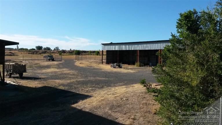 Great location for a variety of heavy industrial use operations. 28 acres located just a few miles NW of Prineville. Property has potential for rail access with Prineville's railroad depot being a neighboring property. The buildings on property include a machine shed and an enclosed shop, there is also a large covered area once used for lumber storage (Approx 300' long and 30' deep). There is a Large industrial well that was used for sprinkling the Log Decks, well log shows 200 gal per minute. Property is set up for 3 phase power with some of the electrical infrastructure in place. Property has some aggregate inventory left on the property that could be mined or used on the property. There is easy access off Lamonta, and additional access off of Bus Evans that gives a direct route to US Hwy 26. Property currently has tenants bringing in $1,500+ per month. All are month to month. Possible owner terms available. Additional maps and information available.