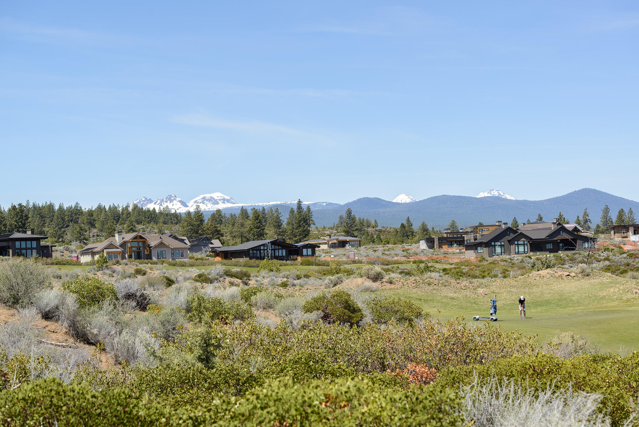 Gorgeous Tripleknot townhome on the 10th fairway in the coveted Tetherow golf community. Incredible, unobstructed Cascade Mountain views. Lovely great room with floor to ceiling windows, stylish fireplace treatment adds architectural detail. Tranquil master suite boasts mountain and golf course views. Spa like bath, double vanities, soaking tub and tiled shower, spacious walk in closet. Private office on the main floor. One upper level Jr suite overlooks the golf course and features mountain views. Second guest suite upstairs as well. Covered patio with electric shades for privacy and sun protection. Spacious 2 car garage with room for extra storage. Fantastic outdoor living and resort amenities at your doorstep. Mount Bachelor Ski Resort is just 20 minutes! Downtown Bend is just a few roundabouts away!