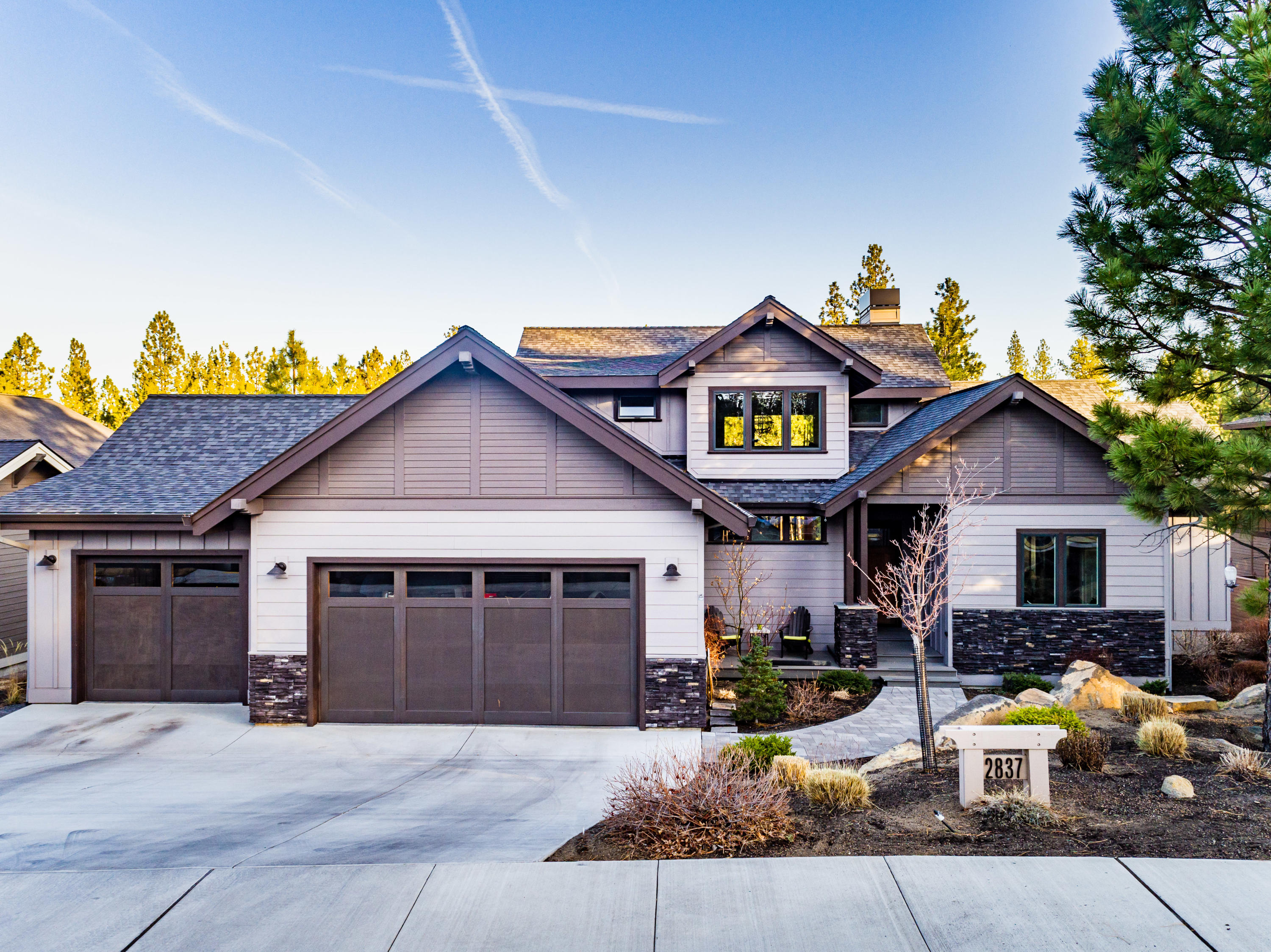 Located amongst the pine trees in The Reserve at Broken Top, you will really appreciate the privacy and 'tree house' feel this home lends. It hardly feels like
you are just minutes to downtown, the Old Mill, NWX restaurants and shops, and schools. Best of all: miles of hiking and biking trails right out your backdoor. The kitchen is a chef's delight with a center island, breakfast bar and big pantry. The great room features a stone and wooden fireplace with metal corner irons. The Madrone wood floors throughout the main level are stunning. Master bedroom features an Italian tiled walk-in shower, quartz counters and walk in closet plus a Dutch door that opens to the amazing and private deck. The main level guest bath has a tiled shower and the office could be used as a 4th bedroom. Upstairs has a spacious bonus room, two more bedrooms and a Jack and Jill bath with each bedroom having their own sink. Large 3 car garage with lots of storage, and additional storage under the house.