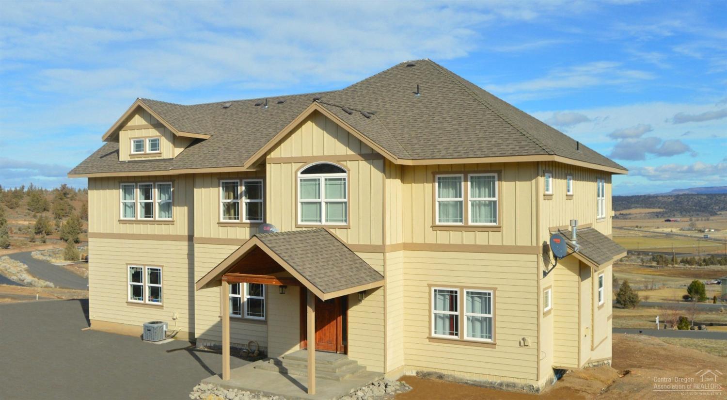 Custom 4250 sq/ft 5 bedroom, 3.5 bathroom home sits on 1.5 acres, includes 9ft. ceilings, granite counter tops, tiled back-splash, island, formal dining area, archways throughout, large bonus/entertainment room, includes bar w/ sink, office/den, 2 master suites, double sinks and jetted tub in master, over-sized laundry/mud room, and includes unfinished basement and finished 3 car garage for all your toys. You won't run out of space in this home. Call today for your personal showing!