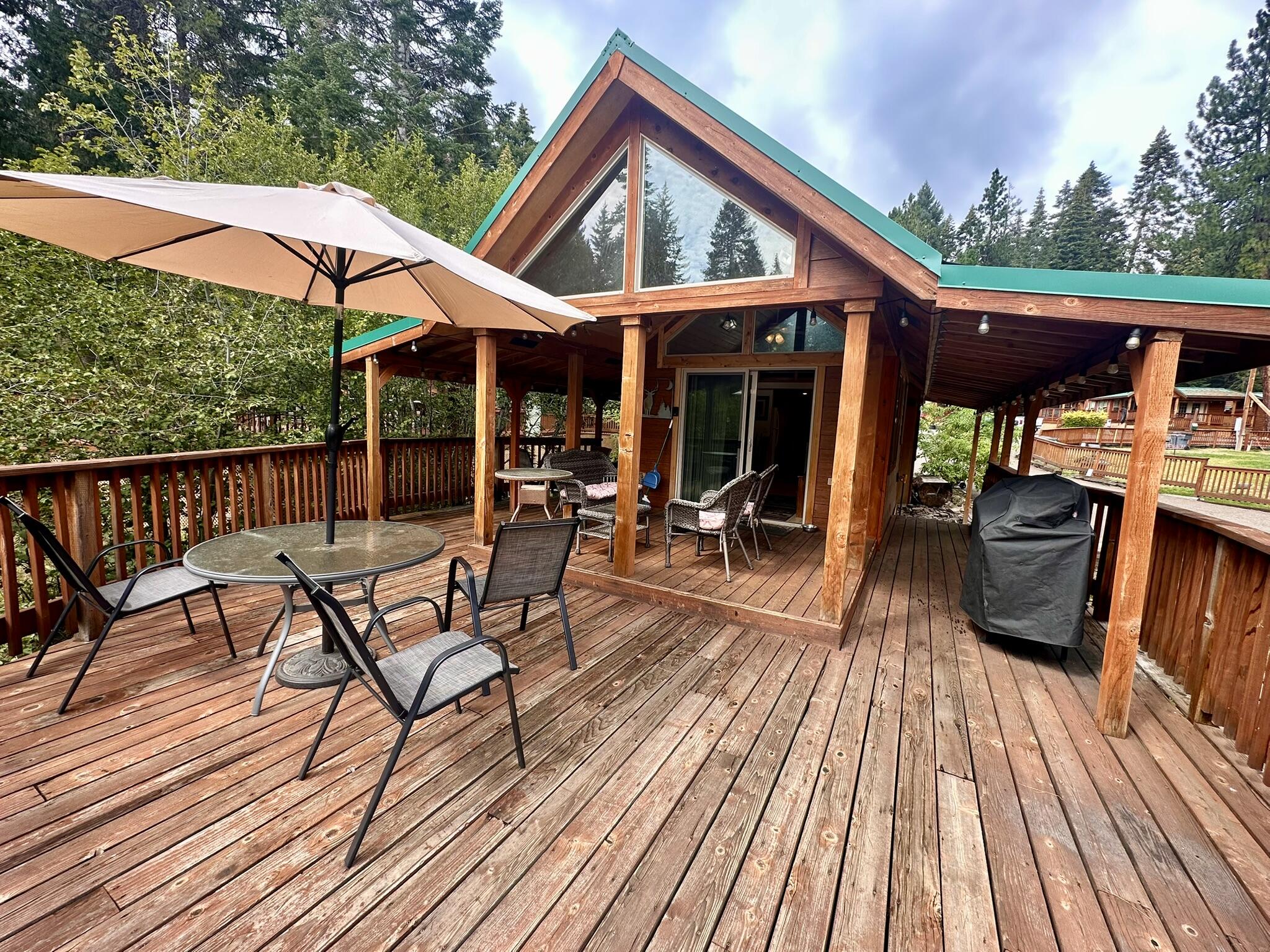 You'll love this fully furnished cabin at Hyatt Lake Resort! Whether you seek tranquility or adventure, this cabin is the perfect base camp for creating unforgettable memories. Inside, you'll discover a fully furnished cabin with a primary bedroom w/ queen bed and a loft featuring a queen & twin bed offering plenty of room to sleep 5 people! The full kitchen with gas range is ideal for preparing delicious meals after a day of exploring. Exit outside to a huge expansive partially covered wraparound deck, complete with a BBQ and a hot tub. This cabin is nestled next to a small creek providing such a peaceful atmosphere. Not only can you enjoy this getaway yourself, but you also have the opportunity to generate income by renting it out. Enjoy easy access to an array of outdoor activities including hiking, fishing, boating, biking, snowshoeing, ice skating, cross-country skiing, and snowmobiling. This cabin offers the best of both worlds - a personal sanctuary & a smart investment!