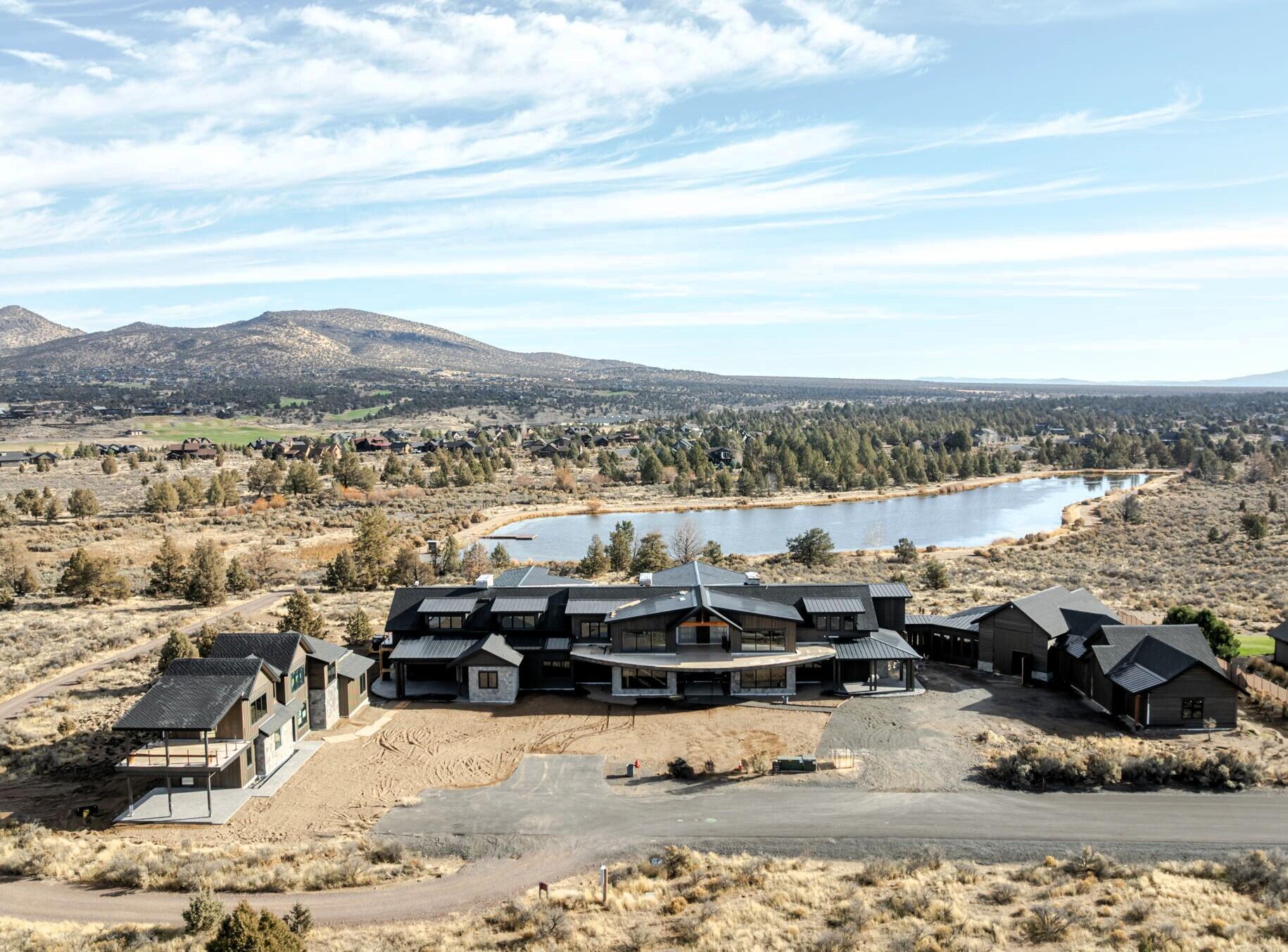 Among Central Oregon's most compelling estates, this Brasada Ranch masterpiece sits atop a private community lake with sweeping Cascade views and BLM land next door for rare privacy. Designed at an exceptional scale for gathering and retreat, it blends expansive indoor-outdoor living, multiple ensuite retreats, and a separate casita with the backdrop of one of the region's premier resort communities. The opportunity: finish the residence your way—continue with the approved plans and professional interior design already in place, or chart your own course and personalize every detail. Then shape the finishing touches to reflect how you live—welcoming big gatherings, quiet mornings, and everything in between. Also enjoy Brasada Ranch's amenity-rich lifestyle—golf, dining, pools, fitness, horseback riding, and miles of high-desert adventure—making this a rare offering for those seeking beauty, privacy, and possibility in equal measure. Check out podcast here - bit.ly/4pEKf12