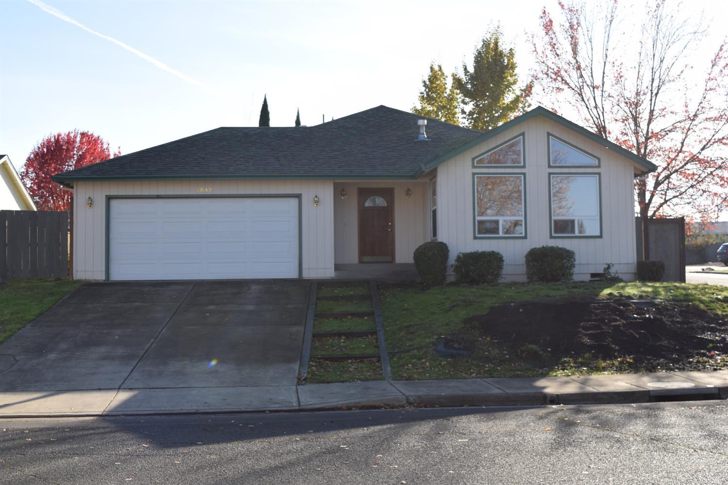 Great, affordable East Medford home with desirable neighborhood. It features 3 bedrooms, 2 baths, 1544 square feet on a 0.19 acre lot. Bright and airy with many accent colors throughout and a number of ceiling fans. Vaulted ceilings, inside utility, double car garage and RV storage access. Seller is offering a $5000 flooring credit with full price offer.