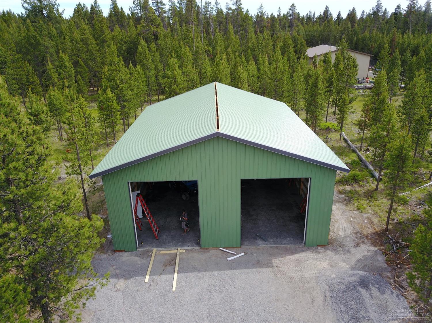 Priced to sell - Wonderfully built 2000 sq.ft. (40' X 50') shop/storage building on 1/2 acre lot, West of Sunriver. Built with your needs in mind to provide secure storage for the RV, boats, trailers, snowmobiles, motorcycles and more! Power with 200 amp, concrete floor, lights, two insulated 12' X 14' garage doors - one with garage door opener, steel 'man door', concrete apron at front, and graveled driveway on a nice road. Can insulate, too. Drive by and call today! + access to two boat ramps included.