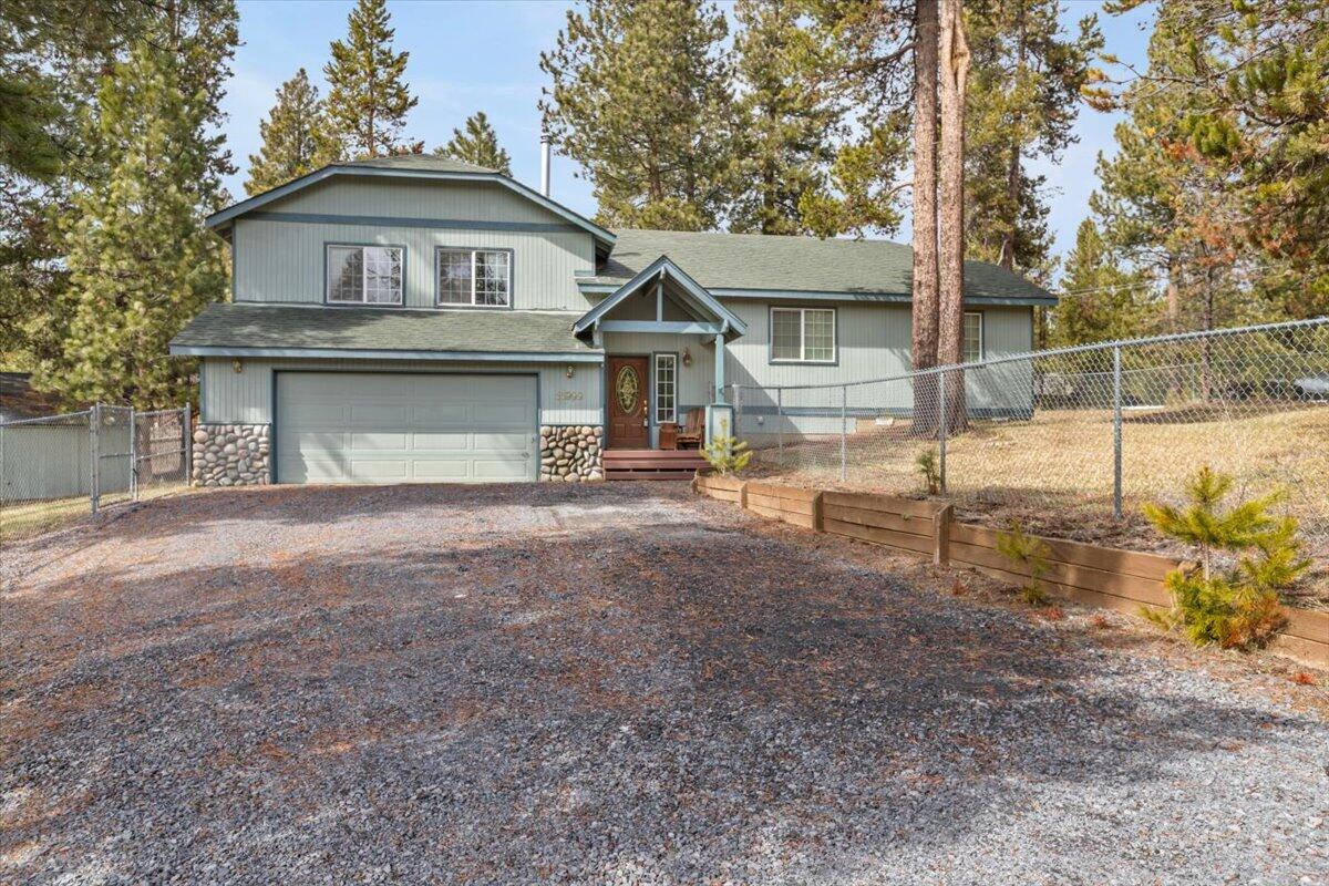 Lovely home that has beautiful vaulted ceilings and hardwood floors throughout. Spacious open floor plan with large windows in living and kitchen area. There is a bonus bedroom and bathroom through separate entrance off of the garage. Large yard that is fully fenced. Access to private boat ramp. Incudes shop/storage building in yard.