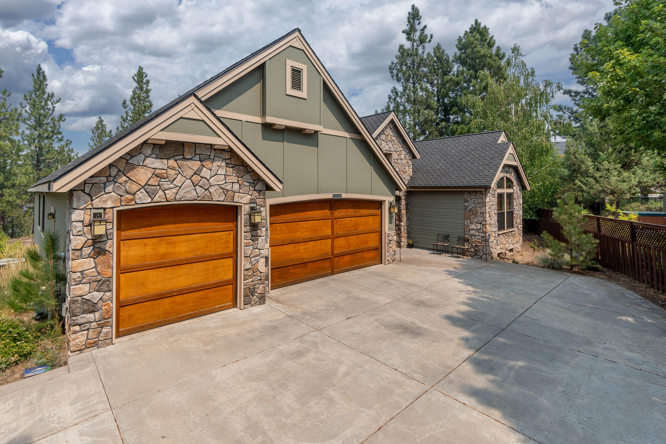 Riverfront retreat in River Canyon Estates! Stunning single-level with 3 bed, 2.5 ba, w/office & bonus room! Large .35-acre lot, with the sounds of the Deschutes River below. Hardwood floors & extensive wood finishes add timeless elegance. Grand great room w/vaulted ceilings & large picture windows framing views of the surrounding nature. Gourmet kitchen is complete with granite counters, SS appliances, island/breakfast bar, and breakfast nook. The oversized primary suite features separate sitting area and primary bathroom with soaker tub, tiled shower, double vanities, and walk-in closet. The guest bedrooms are connected by a Jack and Jill guest bathroom for added convenience. Separate office/den, as well as large bonus room/flex space.  Expansive covered back deck, with beautiful built-in stone fireplace for year-round enjoyment. HOA includes access to clubhouse, tennis court, & swimming pool. Convenient location just minutes from town, the old mill district, shopping & schools.