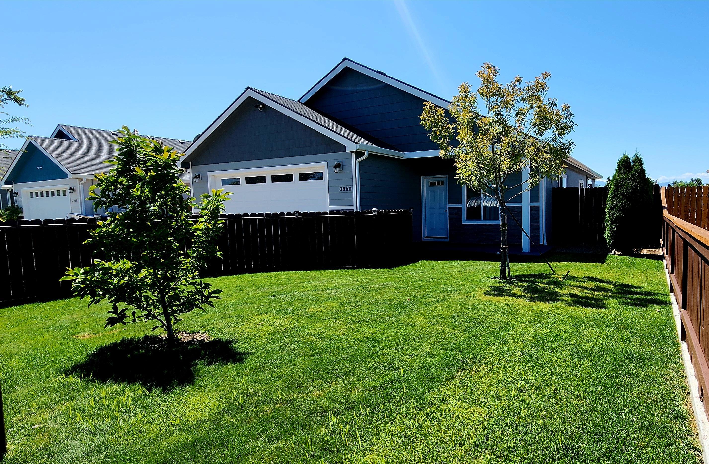 This beautifully maintained 3 bed, 2 bath home on .15 acres in White City looks like new construction! Features include an open great room with vaulted ceilings, granite counters, large island with sink and seating, and a gas stove (never used, per seller). Enjoy a covered patio off the dining area, lush grass with gravel on both sides of the home. The front yard is fully fenced and gated for privacy. Home may be sold fully furnished with a strong offer. Don't miss this move-in ready gem—call today to schedule your showing.