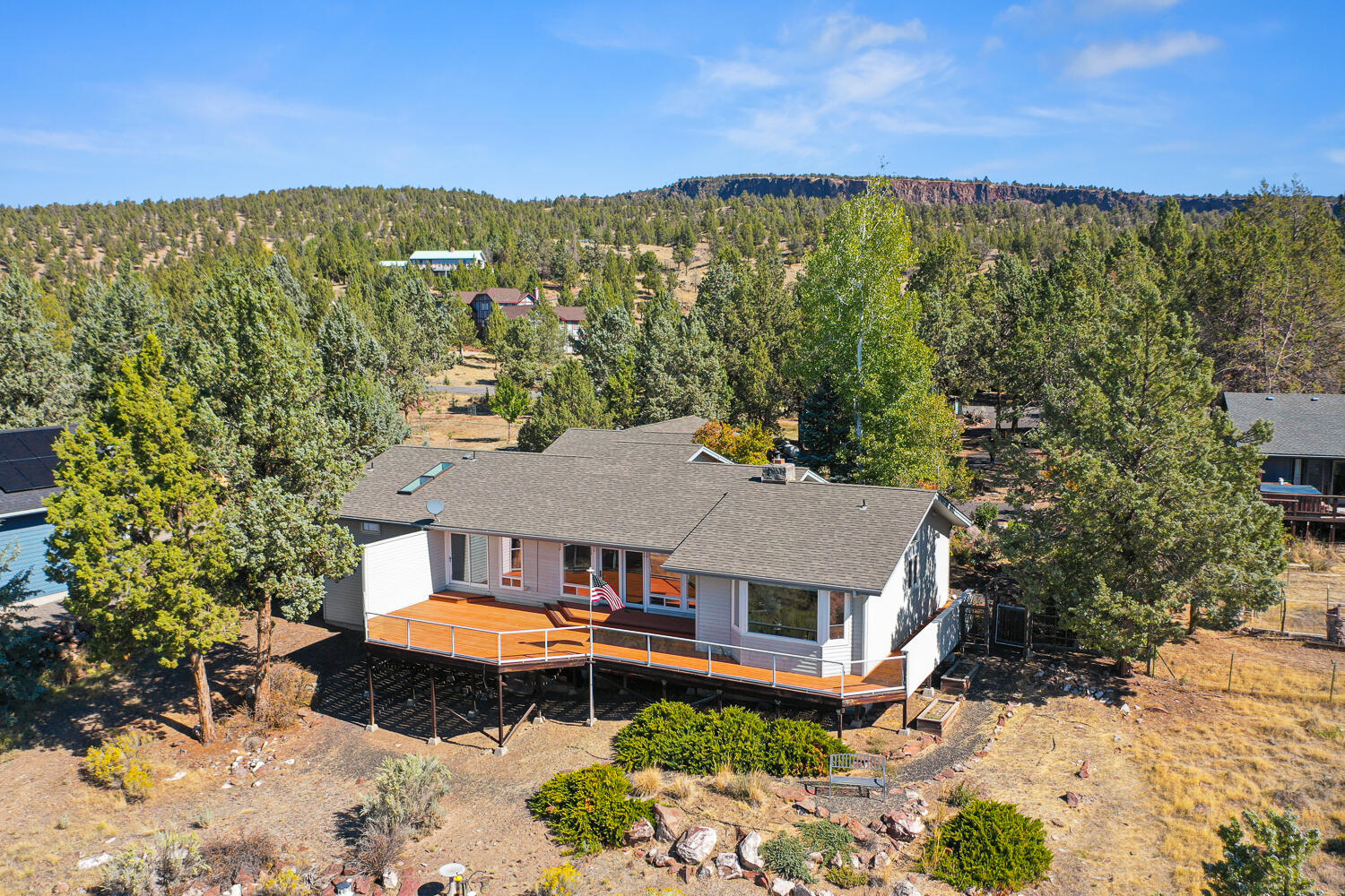 Custom 3-bedroom, 2.5-bath home designed to maximize views with large windows throughout. Walk in to the large open living room with a beautiful rock fireplace and tongue and groove ceiling, formal dining room with built in buffet and custom ceiling then meander to the large kitchen with breakfast nook. The spacious primary suite includes ample closet space and a private bath with a walk-in jetted tub. Outside, enjoy phenomenal views of the Prineville Valley and Cascade Mountains from the expansive deck with glass railing or relax on the private back deck with a swim spa. Property features include a 2-car detached garage with an additional 1 bay heated wood working shop, RV parking, and a paved driveway for convenience. A perfect blend of comfort and breathtaking scenery.
