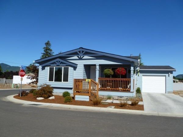 Look!!! Everything is done and ready for you to move in. This 1680 sq ft 2 bedroom 2 bath double wide has all the f features you've been looking for. The ceiling fans are already in, wood shelving has been installed in the pantry and closets, newer kitchen faucet, upgraded kitchen sink, water system, sprinklers, garage, AC, craft/den/office, outside outlets for holiday lights, and gas fireplace. The Sellers had the unit extended an extra 2 feet when built. Enjoy your meals in the dining area or at the kitchen island. When you want to relax and get away, enjoy the bubbles in the outdoor spa under your private gazebo. You'll never run out of storage space with the extra large garage which is also fully insulated with a handyman's work bench. The back yard has an irrigation system and is just waiting for your personal touch. When you have a large group to entertain, the clubhouse is available.