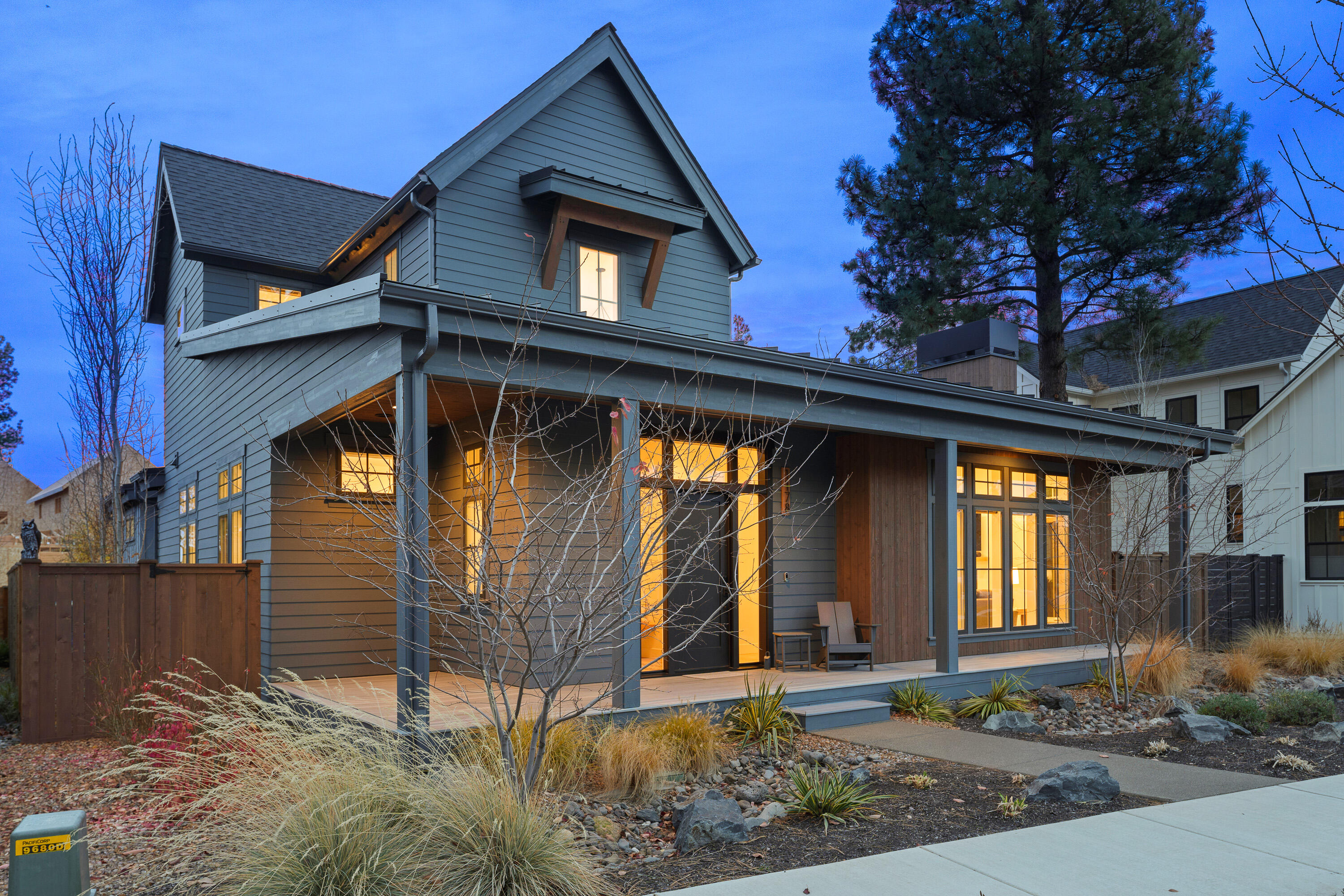 Modern Farmhouse perfection in desirable Discovery West, originally built by Sunwest Builders - known for their quality craftsmanship and timeless design. This 2,126 sq ft home blends clean lines with cozy charm, featuring floor-to-ceiling windows, custom lighting, cabinetry, and solid surface countertops. The main-level primary suite offers comfort and privacy, while a loft and two additional bedrooms upstairs provide flexible living space. A spacious garage includes a tandem bay with an 11' door, ideal for a Sprinter van or adventure gear. Outdoors, the fully fenced and landscaped yard with a built-in firepit is made for relaxing under the stars. Enjoy Discovery West's beautiful trails, parks, and the newly opened Discovery Corner - just moments from all the restaurants and shops of Northwest Crossing. Meticulously maintained and thoughtfully upgraded - this one truly lives better than new.