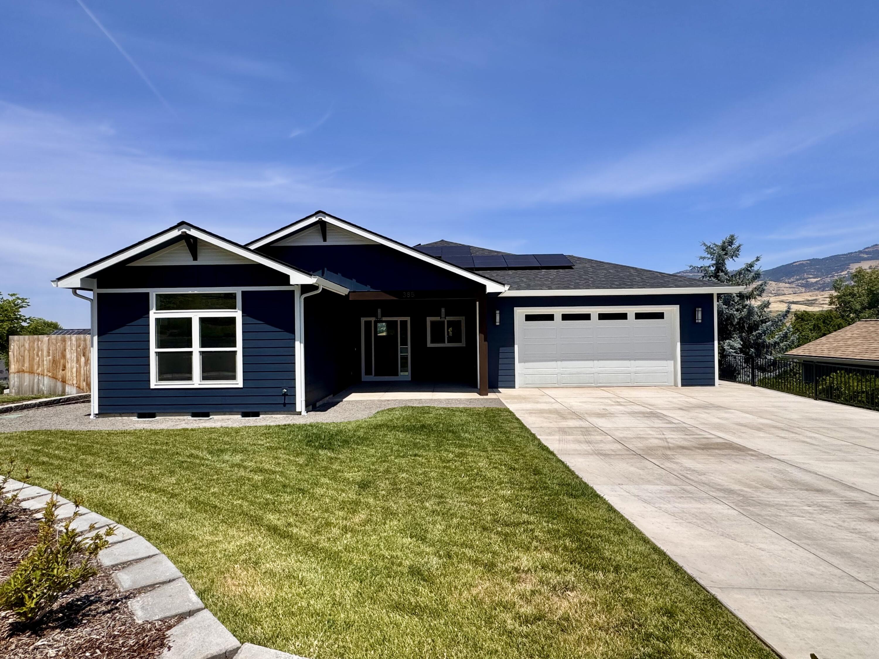 A new Taylored Elements Construction home of this quality and location don't come around often with views that are second to none of Grizzly Peak, bluffs & valley all while being less than a mile from downtown. The main level is 2057 sq ft, 3 bedrooms, 2.5 bathrooms, with an open floor plan, engineered hardwood floors, beautiful functional kitchen with high grade appliances, pantry, quartz counter tops, custom cabinets with soft close drawers, tiled backsplash, niche and large island. The spacious living area has a gas fireplace and access to 2 decks. The primary suite has a coffered ceiling, walk in dual headed shower, dual vanity & large walk-in closet. The 945 sq ft lower level has a separate exterior entrance, will be finished as bonus space with a full bathroom and is prepped to be an ADU per the plans. This energy efficient, comfortable and sustainably built Earth Advantage Platinum home has an 8 kw solar panel system & EV charger in the oversized 2 car garage. Come see it today