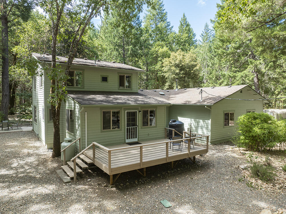 Incredible Home & Property on Year Round Deer Creek! 18+ Acres of End-of-the-Road Privacy with BLM on Two Sides. A Beautiful Forest & Spectacular Creek Frontage truly make this a One-of-a-Kind. Attractive & Welcoming Home that offers Open Living Space, a Comfortable Flowing Floor Plan, Extensive use of Natural Organic Materials, & a Light & Bright Interior. New Improvements include a Sunroom w/Incredible Swim-spa, 2nd Full Bath, & Fully Remodeled Kitchen! Level & Useable Property, Beautiful Landscaping, Walking Paths throughout, Established Garden & Fruit Trees. Wonderfully Managed Forest w/Impressive Trees. Attached Finished 2+ Car Garage w/Shop Space, Nearly Completed Highly Attractive Studio/ADU, & Log Carport made from Timbers on the Property! Deer Creek flows pristinely all year right through the Property. The perfect Home & Property in a Quiet & Private Setting! Direct Road Access to over 15,000 Acres of BLM & Forest Service Lands, with Roads, Hiking Trails, Creeks & Wilderness!