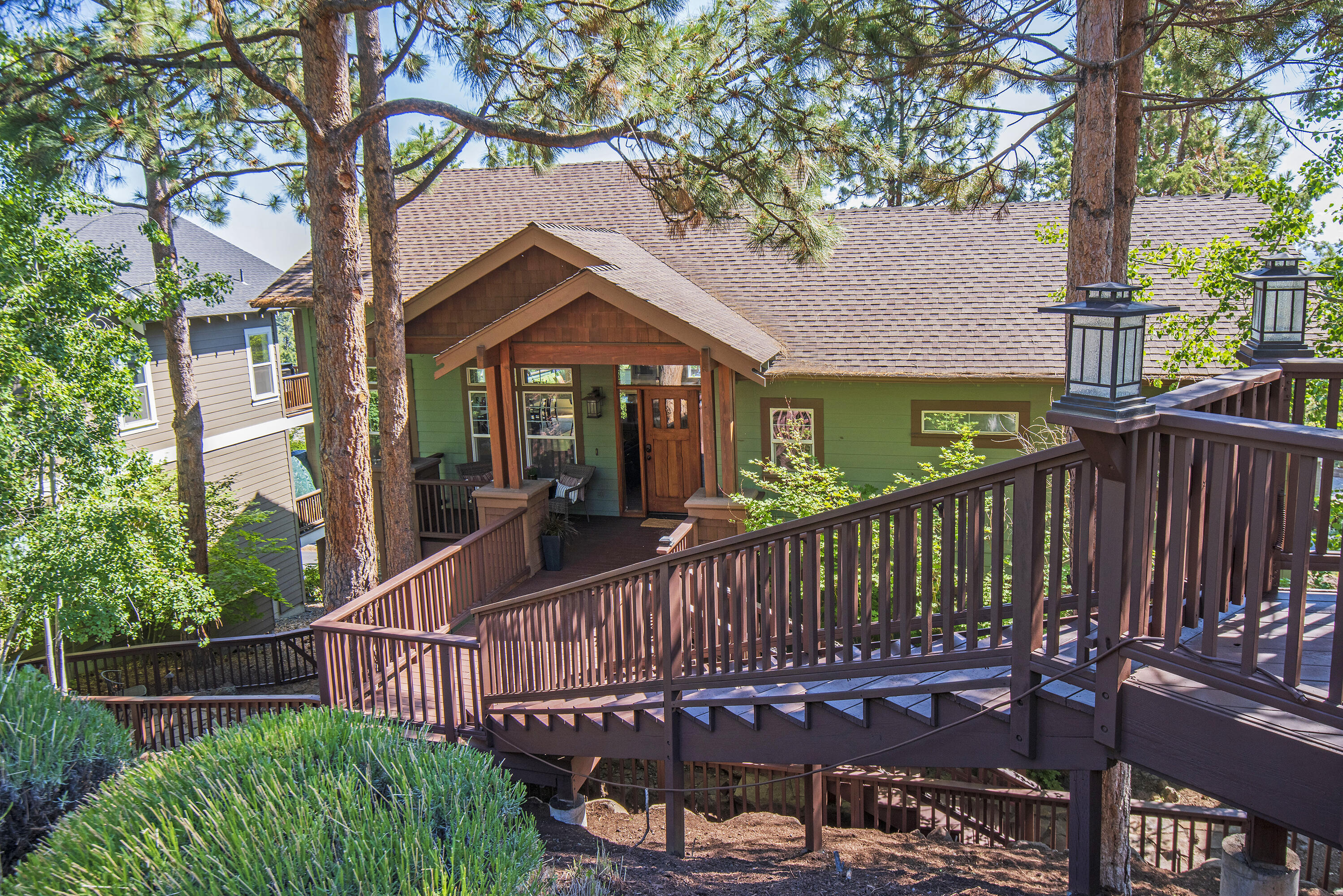 A beautiful craftsman's in Awbrey Village! As you enter the home you are greeted with a beautiful open great room. The easterly views are stunning as you cook and entertain in a tastefully remodeled kitchen with new high-end appliances. A large quartz island with seating adjoins dining area and deck to enjoy warm summer nights. Enjoy sitting together in the spacious living room with gas fireplace and built-in TV cabinet. The main level primary bedroom has an updated primary bath with walk in tiled shower, soaking tub, double sinks, walk-in closet, and radiant floor heat. Downstairs you will find three additional bedrooms, one of which is currently being used as an office and tv room.  Roomy, walk-in, ground-level storage areas where you will find the gas furnace, humidifier and a filtered water system, lockable and room for your bikes and more! Low maintenance yard featuring hardscaping, a water feature and low maintenance landscaping.