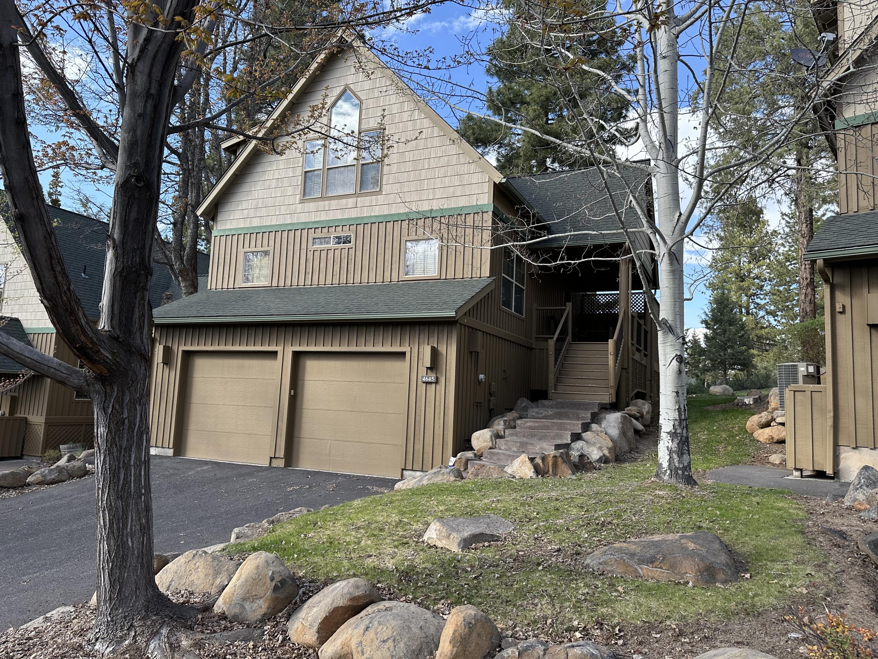 One of a kind 3 bedroom 2, bath vacation home with floor to ceiling fireplace and 2 car garage.  Being sold by original owners and it has never been rented.  Northwest look with top of the line log furnishings to complete the woodsy feel.  Great as a primary residence or vacation home with large deck and hot tub.  Furnishings are negotiable.