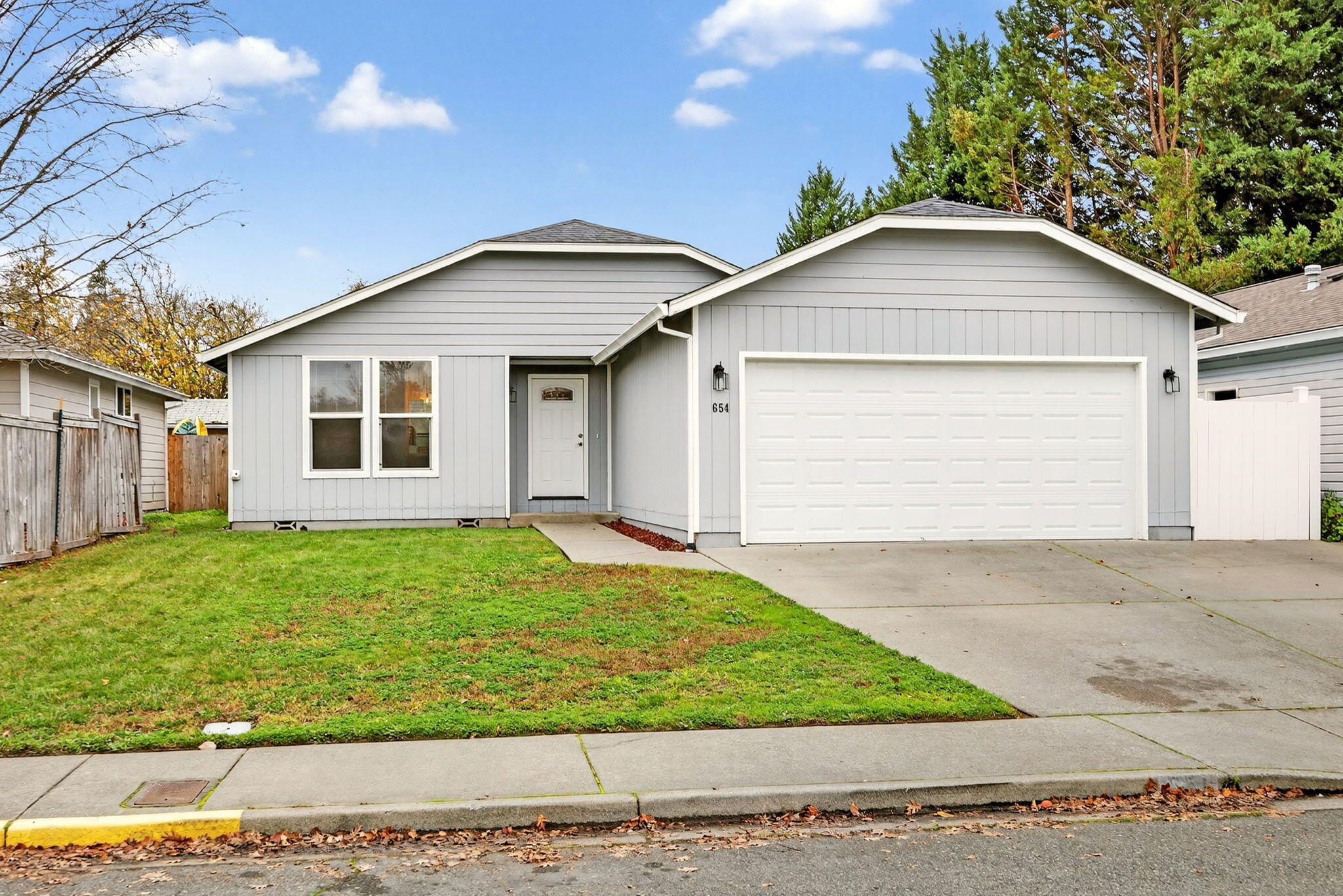 Move-in Ready and many upgrades have been done to this great home, newer Roof, and just replaced  Water Heater. Featuring a 3 bedroom, 2 bath home with 1200 sf.  Great room with, slider to the covered patio, breakfast bar and dining area.  Light and bright kitchen, oak cabinets and pantry.  En-suite bedroom with newer vanity walk-in closet and stall shower. Perfect split-floorplan. A newer HVAC, Roof, Gas Water Heater, light fixtures and blinds.  Attached 2 car garage. Convenient location; close to town for shopping and hospital.  Take a look today.
