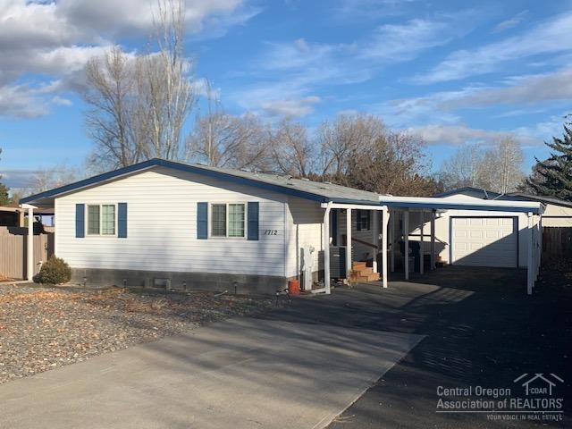Great affordable family or downsizing home in Central Oregon!! 3 Bedrooms, 2 Baths, vaulted ceilings with updated kitchen and baths, be sure to check out the pics. Don't forget backyard on a cul-de-sac and a single car garage with carport and large driveway. And did I forget to say there is nothing like sitting in a Hot-Tub when it is snowing or using the A/C in the summer. Backyard just needs your LOVE.