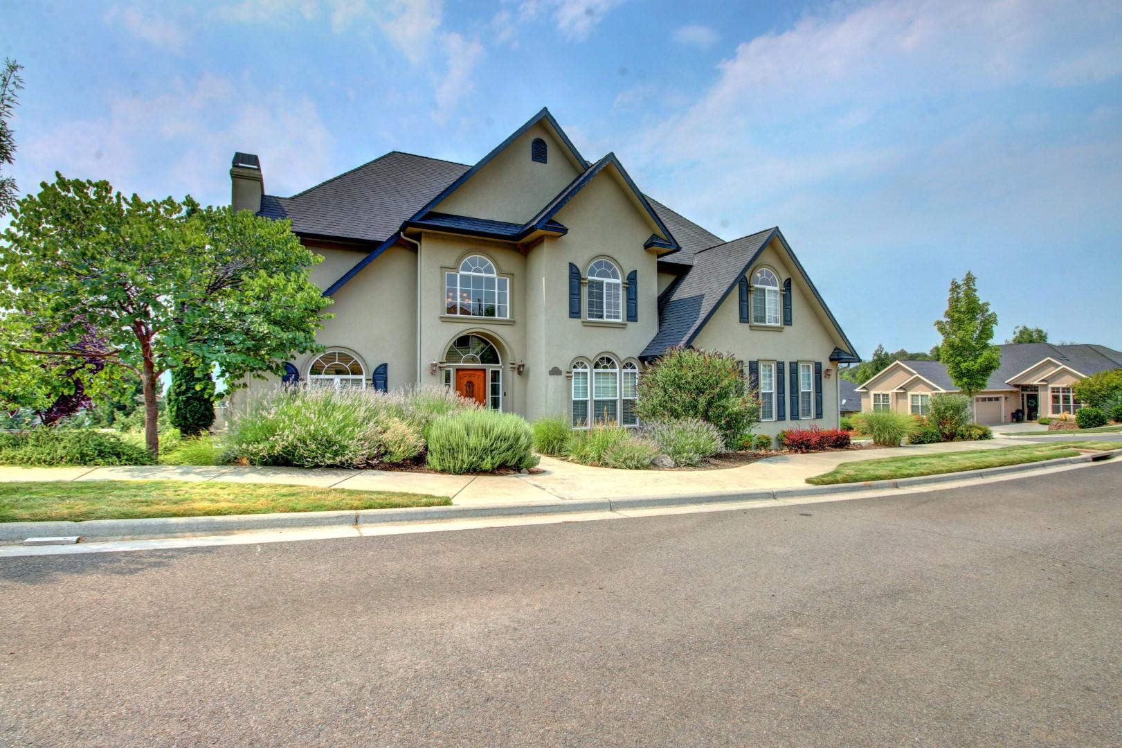 Stunning curb appeal as you approach this impressive home that was truly built for entertaining!  Living room and office flank the hardwood center-stair entry. 
Granite kitchen has massive island with breakfast bar, double ovens, 5-burner gas range with pot-filler, and an abundance of cabinetry.  Expansive granite butlers/serving room with glass-fronted cabinetry, sink, and wine refrigerator.  2-story family room with built-ins.  Upstairs is home to the vast master suite with gas fireplace, double walk-in closet, jetted tub, and sitting area.  2 additional bedrooms (each with walk-in closets), guest bath, and laundry room finish out the level.  Additional gas fireplaces in both the living and family rooms, sound system throughout.  Kitchen and dining rooms have French doors that open to the view deck with 2 separate entertainment areas.  Cherry and peach trees, easy-care landscaping, and currently no development to the east which lends to no traffic on this short stretch of the roadway