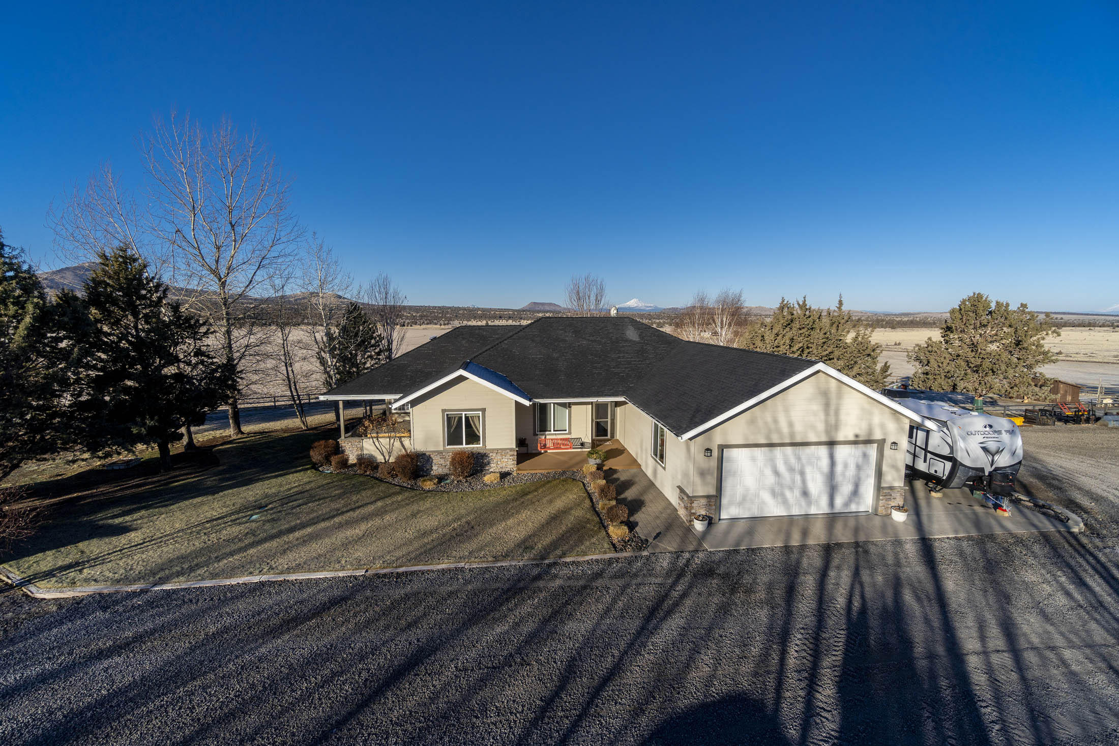 Facing the beautiful Cascade Mtns is an exceptional 2400 sq ft custom home overlooking a High Value ODA Certified Weed Free 160.04 acre horse hay farm/ranch with 125 irrigated acres by its own private well.  Property irrigated with a full circle pivot with VFD pump, flow meter, and LESA-LEPA sprinkler system for higher efficiency.  Equipped with two large hay sheds, barn with corral and perimeter fenced pasture, machine shed/shop, and chicken coop makes this a perfect farm/ranch property.  Bring your horse or 4-H projects.  Property borders public lands on 3 sides for endless horseback riding or hiking.  ATVs allowed on existing roads only.  This beautiful home's kitchen is nicely appointed with maple cabinets, expansive granite tile counter tops, a Jenn-Air induction cook top, French door ss refrigerator, and pantry with slide out drawers.  A large pantry room has shelves 10 ft high.  Outstanding Cascade Mt. views from every window on west side of home.  Must see!