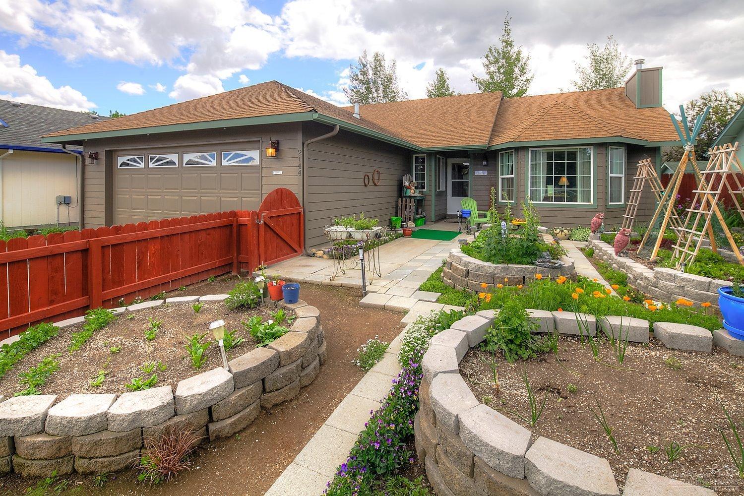 Enjoy the summer in your new NW Redmond Home! Freshly painted, fully fenced & landscaped, this home is ready for new owners. Vaulted ceilings in the Great Room & Master Bedroom make the home feel spacious & light. Open Kitchen w/ Bar Seating & plenty of work space, tons of storage. Master Suite w/ Double Sinks & full sized shower. Outdoor garden spaced & raised flower & vegetable garden beds already planted & growing! Quiet, dead end street is neat & clean.