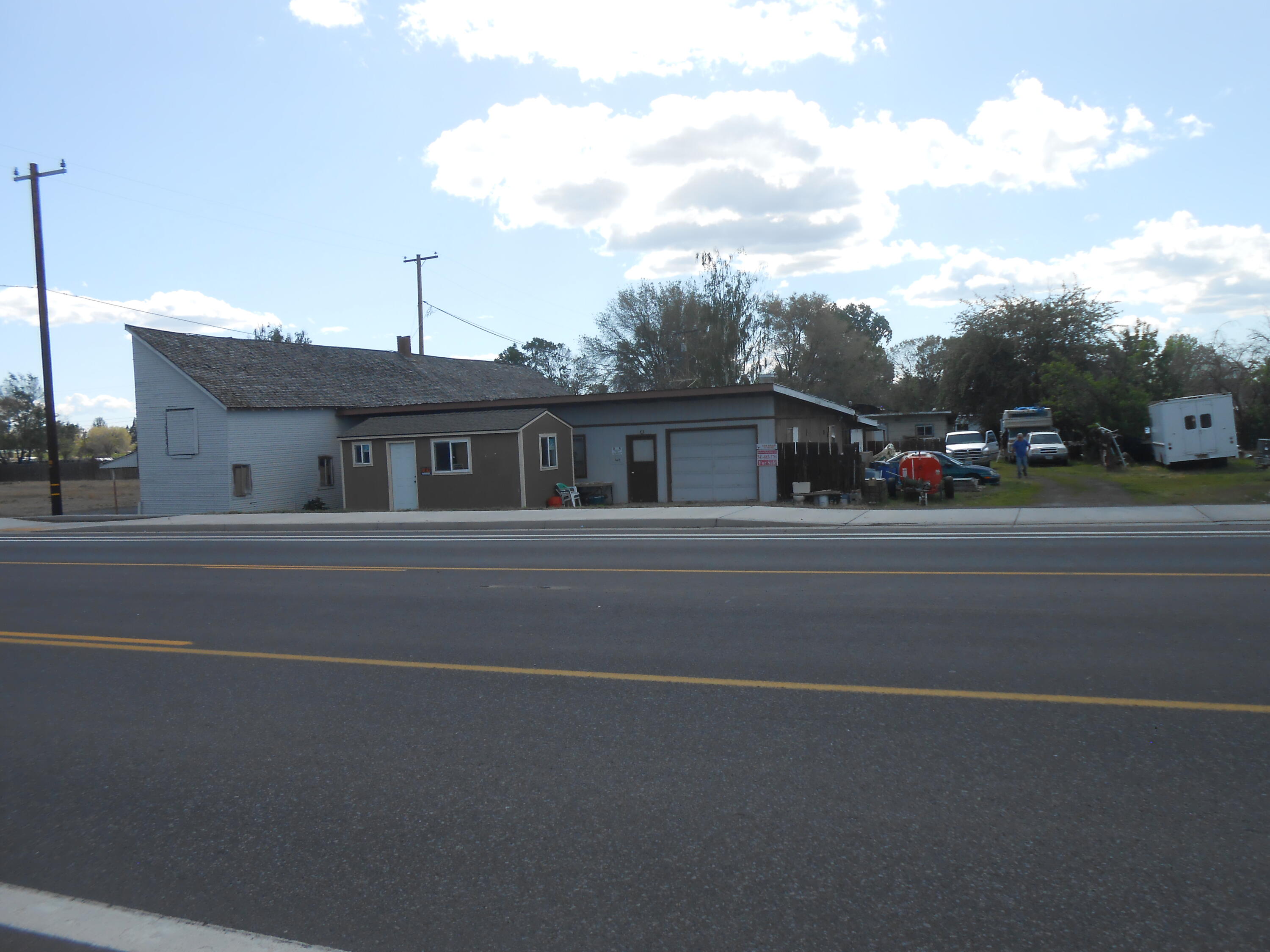 Over 1/2 acre of grandfathered residential/commercial property including a         3 bedroom one bath home for a caretaker as it is ashed manufacturing business and general contractors office at the present time.  Do something good with your tax return