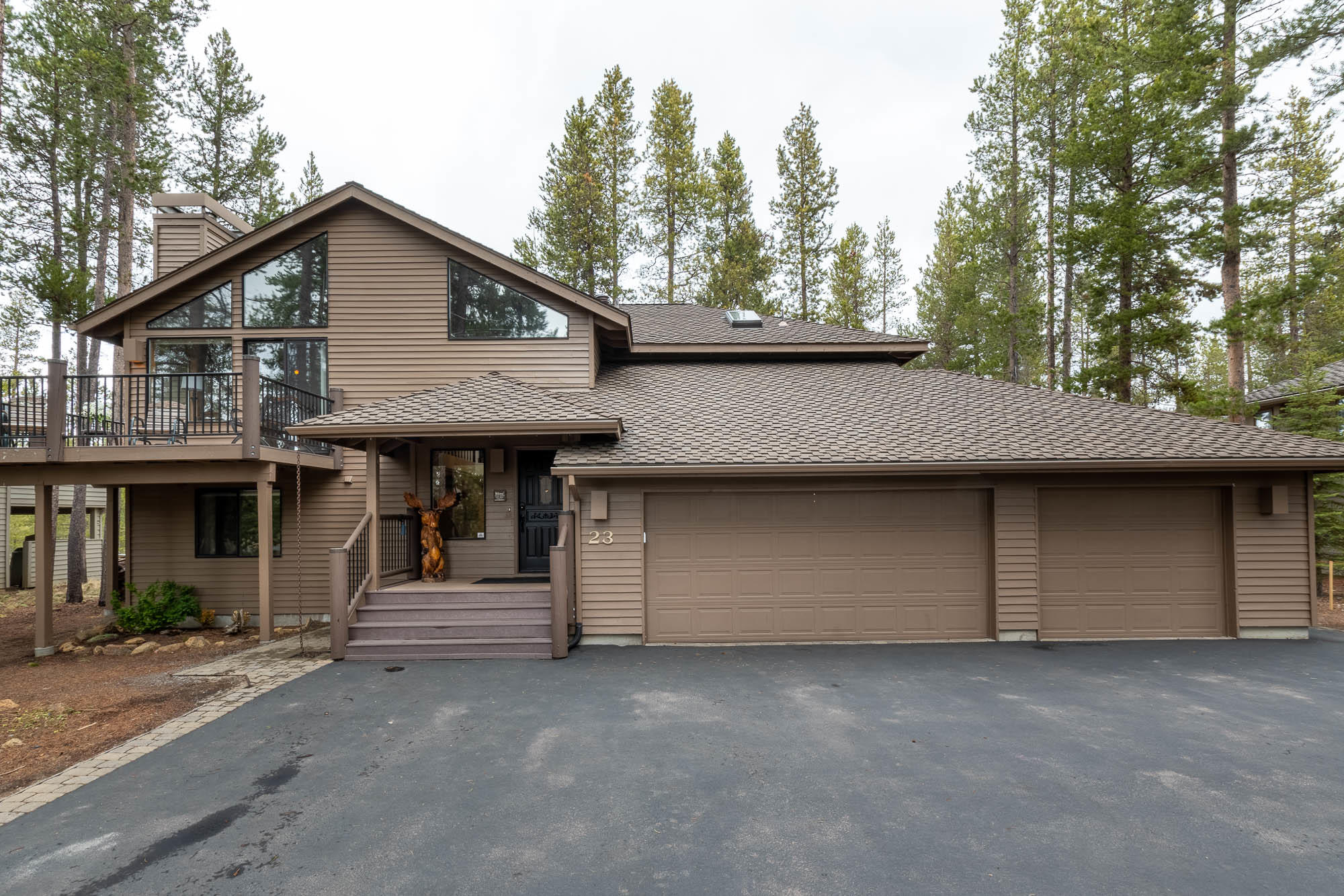 LOCATION! LOCATION! The sought-after National Forest setting with bonus Mt. Bachelor View from the kitchen & upper Trex wrap around deck. Covered Trex porch & wide stone entryway leads to a vaulted great room w/ wood burning FP insert. Off the upper deck is a SAUNA & a wood lift relieving needs to carry firewood upstairs!  Granite kitchen counters w/ eating bar, SS appliances, tons of cabinetry, plus hot water pot filler at stove. Upstairs master suite has gas FP & access to hot tub. Main master bath offers dual sinks, heated floor, huge walk-in closet & skylights. Downstairs are 4 bdrms w/ large closets. 2 Guest bdrms are en-suites w/ granite counters & tile floors. 2 Bunkrooms are Jack &Jill suites w/ granite counter & tile floor. Lower-level deck access from 2 bdrms. Washer/dryer in lower hallway closet & 2nd set in garage. Lock-off 3rd garage bay, plus storage area. Paver accented driveway & plenty of parking. Dog run. A/C. SHARC paid. Established rental.