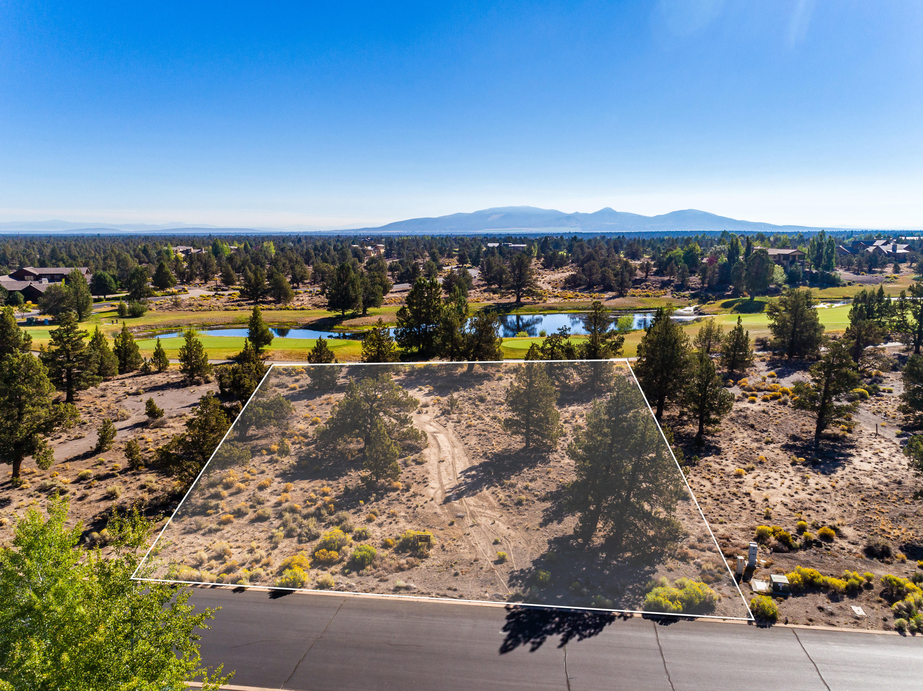 Serene .68 acre flat lot overlooking the beautiful lake on the 6th hole of the Tom Fazio Championship Course at Juniper Preserve and Pronghorn Club. Enjoy fantastic views from the tee of the par-4 and the trickling stream that runs down the length of the hole. This large lot allows for tons of options for building your dream home. $115,000 Pronghorn Membership Deposit is included in the price of the lot.
Named by golf magazine one of the 25 best golf resort communities in the United States, enjoy easy access and close proximity to the grand 55,000-square-foot clubhouse at this beautiful high desert oasis. With 2 world class golf courses, both boasting international accolades, & all the amenities of Pronghorn resort, including 3 swimming pools, tennis court, spa, numerous dining outlets, & the Juniper Lodge - a 104 room boutique hotel. Whether planning a primary residence or a second home, this private lot is the perfect spot for a new home adventure.