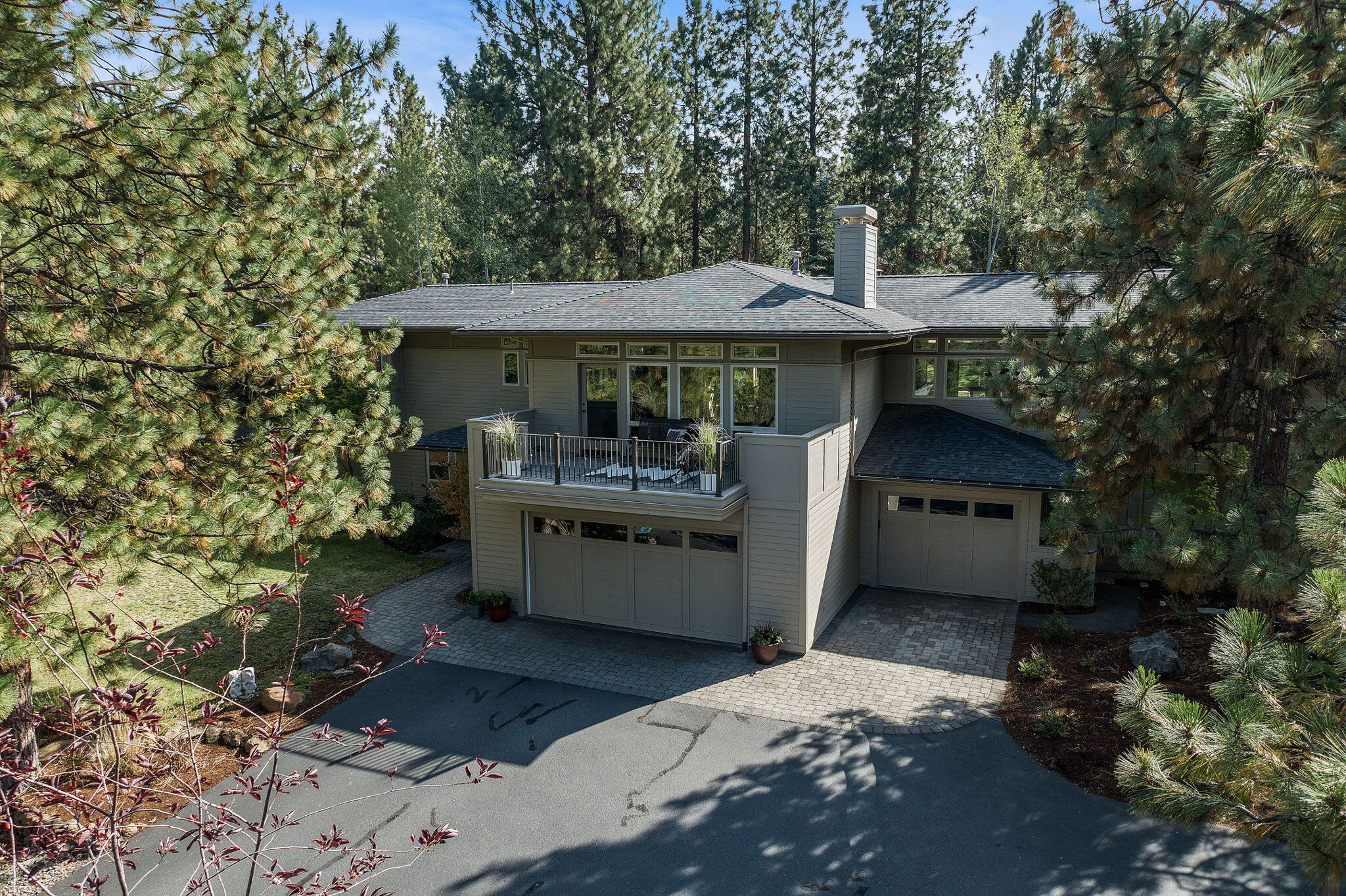 Premier location in Awbrey Glen on Champion circle. This 4 bedroom 3 bath (two main suites) Northwest style home sits on a bright partially treed private .63 acre lot.  Just a short walk to the Awbrey Glen pool/fitness and clubhouse where you can swim, workout, golf, dine and socialize without ever getting in the car. This home features a spacious layout with abundant natural light and large windows overlooking the back yard and trees that surround this private comfortable haven. The master bedroom features a stone tile shower with glass door and a generous walk in closet. The living room features a fireplace with custom built in book shelves .Stone tile floors throughout the majority of the home and brand new carpeting in the bedrooms and living room. This home has been lovingly maintained by it's owners. The large 4 car  garage has plenty of room for vehicles as well as all your Central Oregon toys.