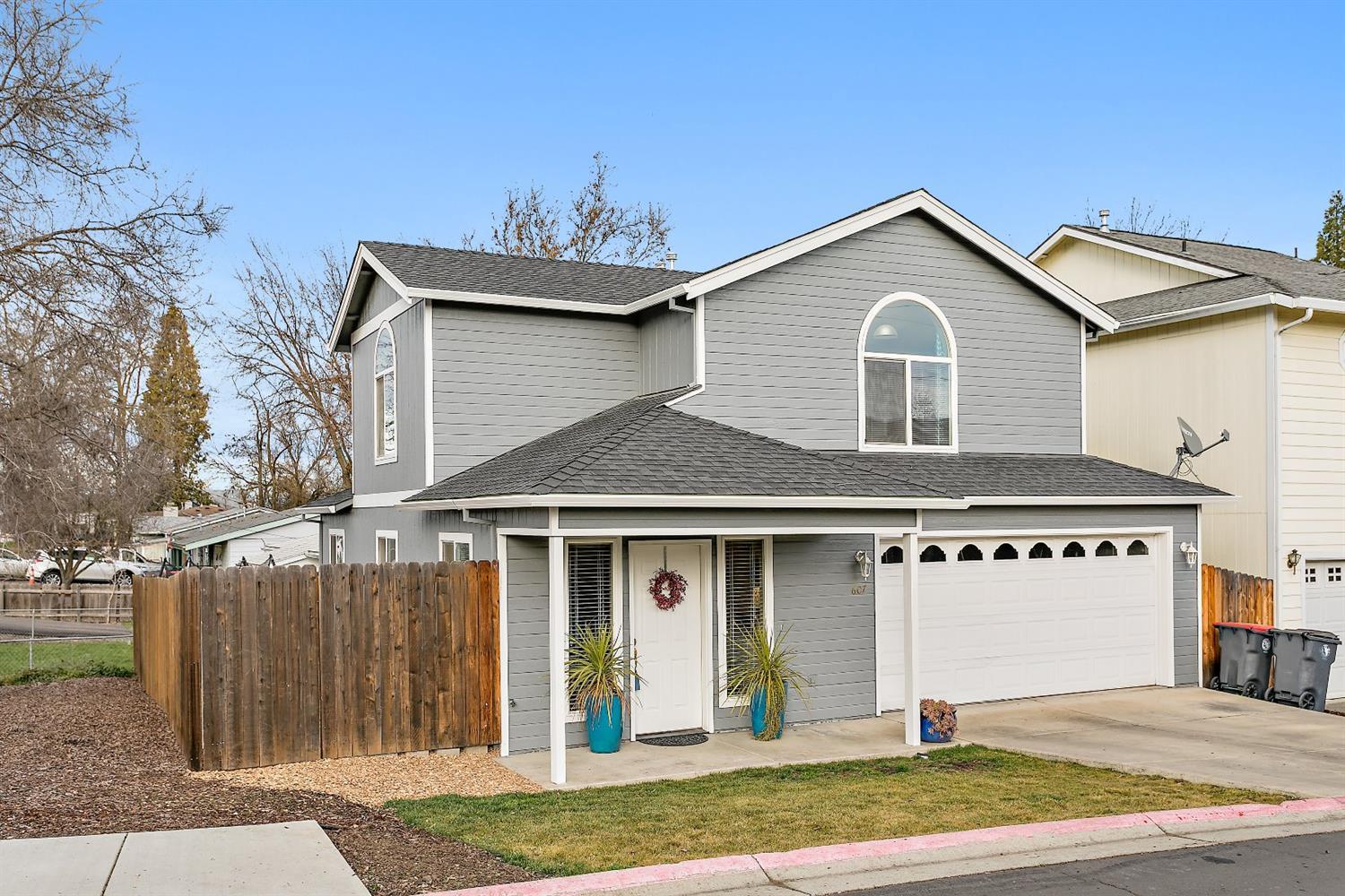 Cute, clean & ready for new owner! Covered front porch and back deck. Living room open to dining room. Kitchen has two-seat eating bar and pantry closet. Vaulted ceiling in master and one of the guest bedrooms. Double sink vanity and linen storage in master bathroom. Laundry closet located off upstairs landing. 2017 updates include new hot water heater, fresh exterior and interior paint, new laminate flooring and baseboards lower level, and new zone system for HVAC system. Two car attached garage with ductless heat and air. What a gem for a first-time home buyer or investor!
